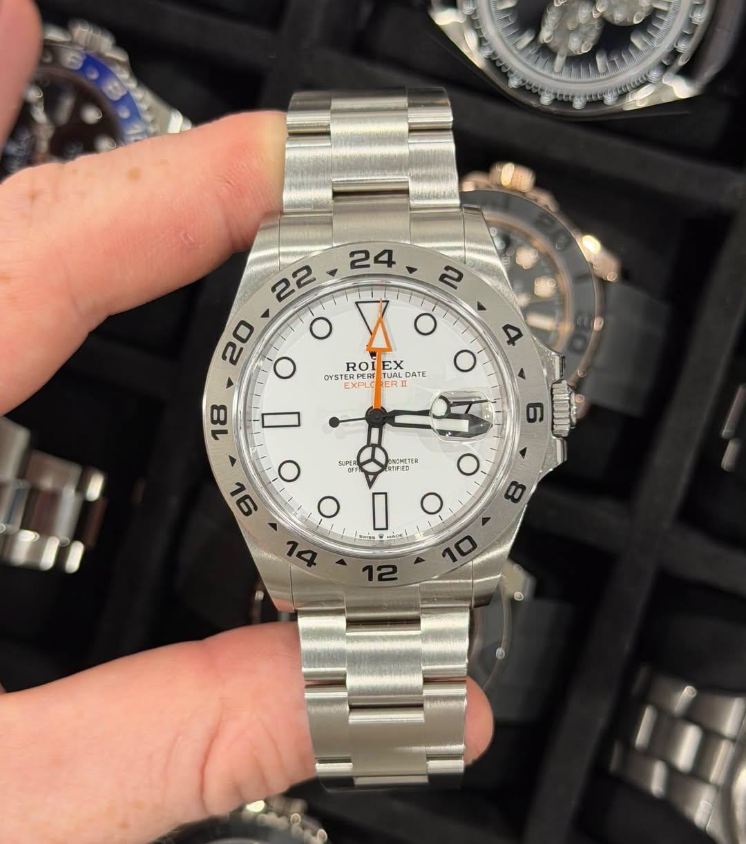 May be an image of wrist watch and text