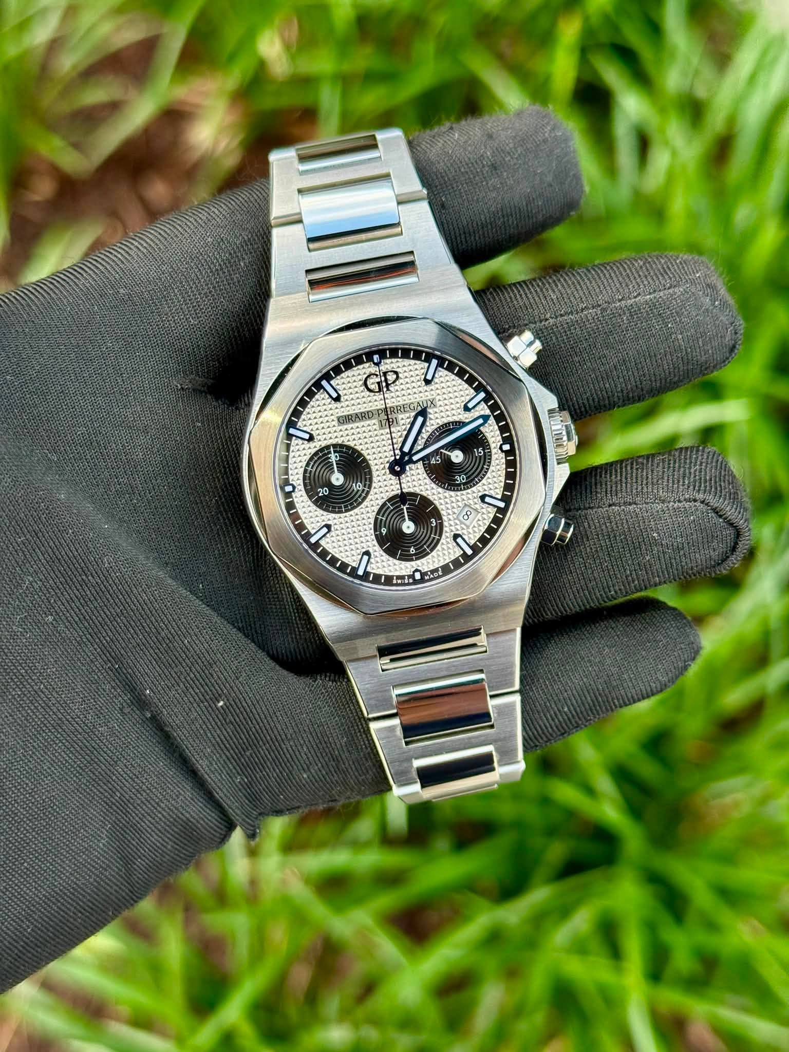 May be an image of wrist watch and text