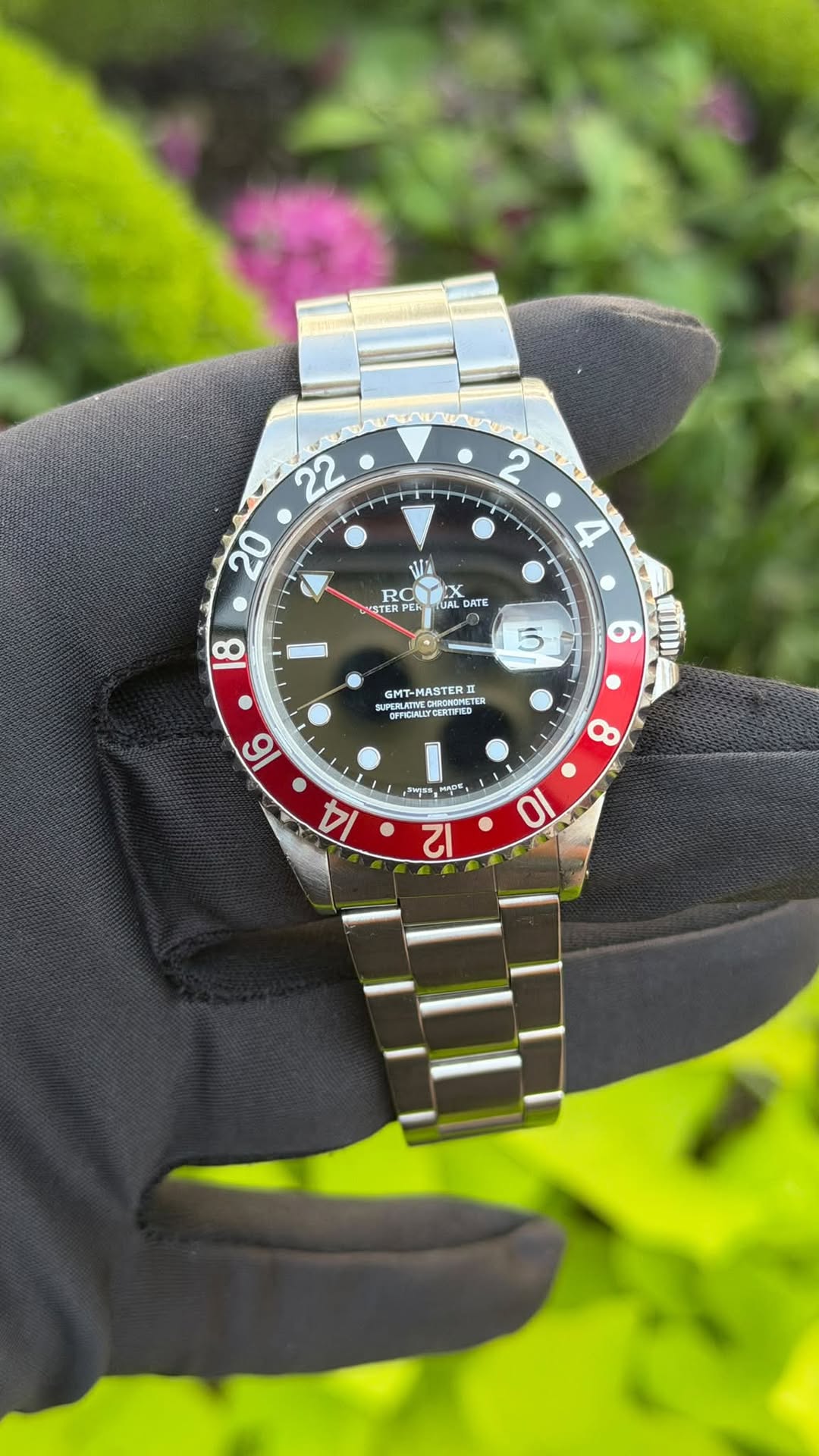 May be an image of wrist watch and text