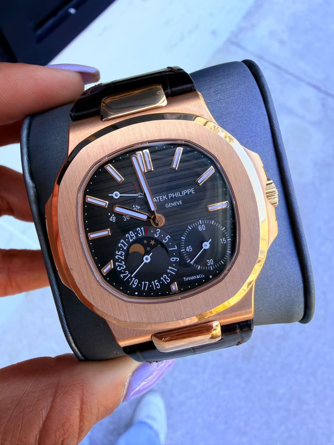 May be an image of wrist watch and text
