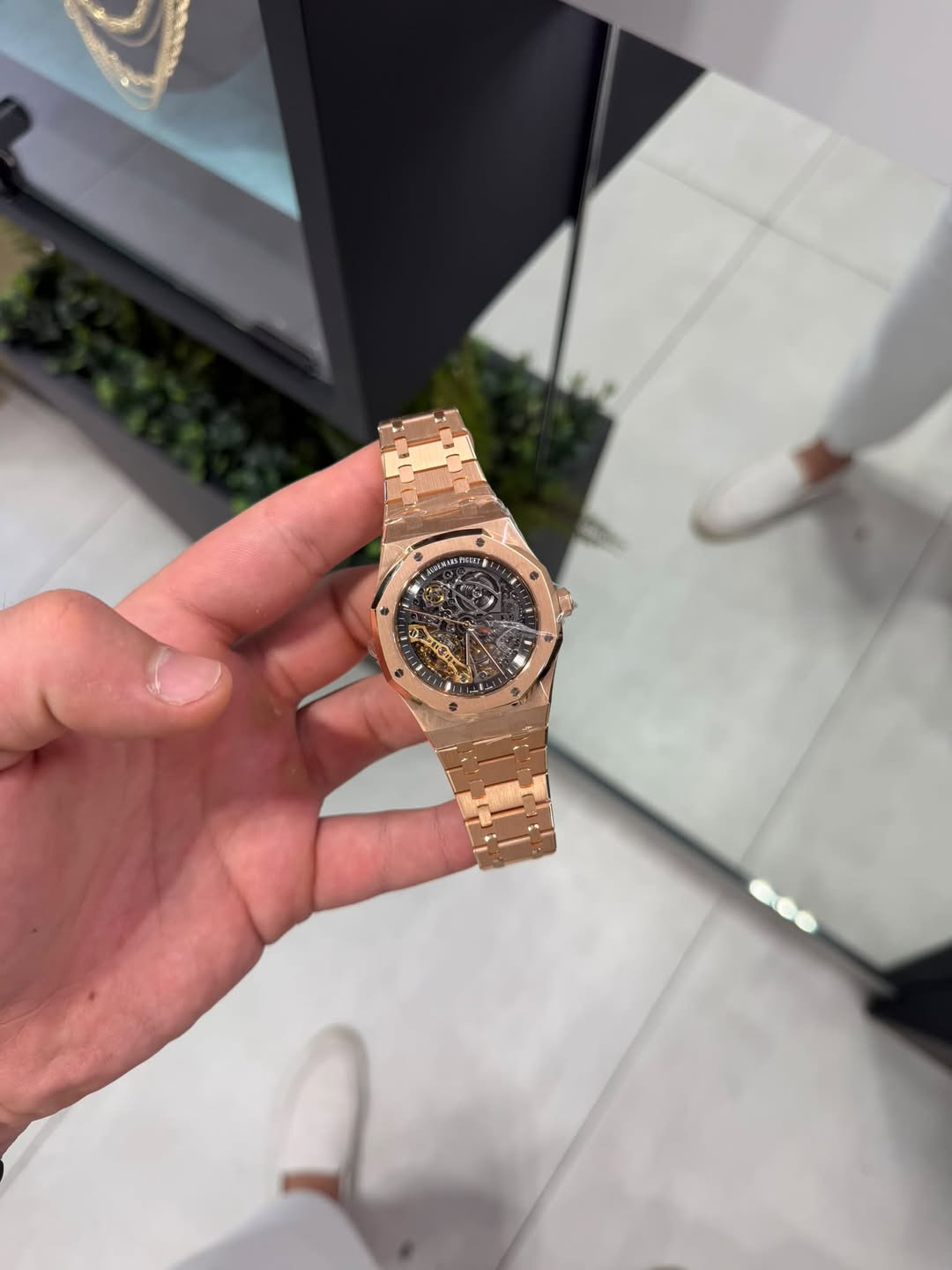 May be an image of wrist watch and text