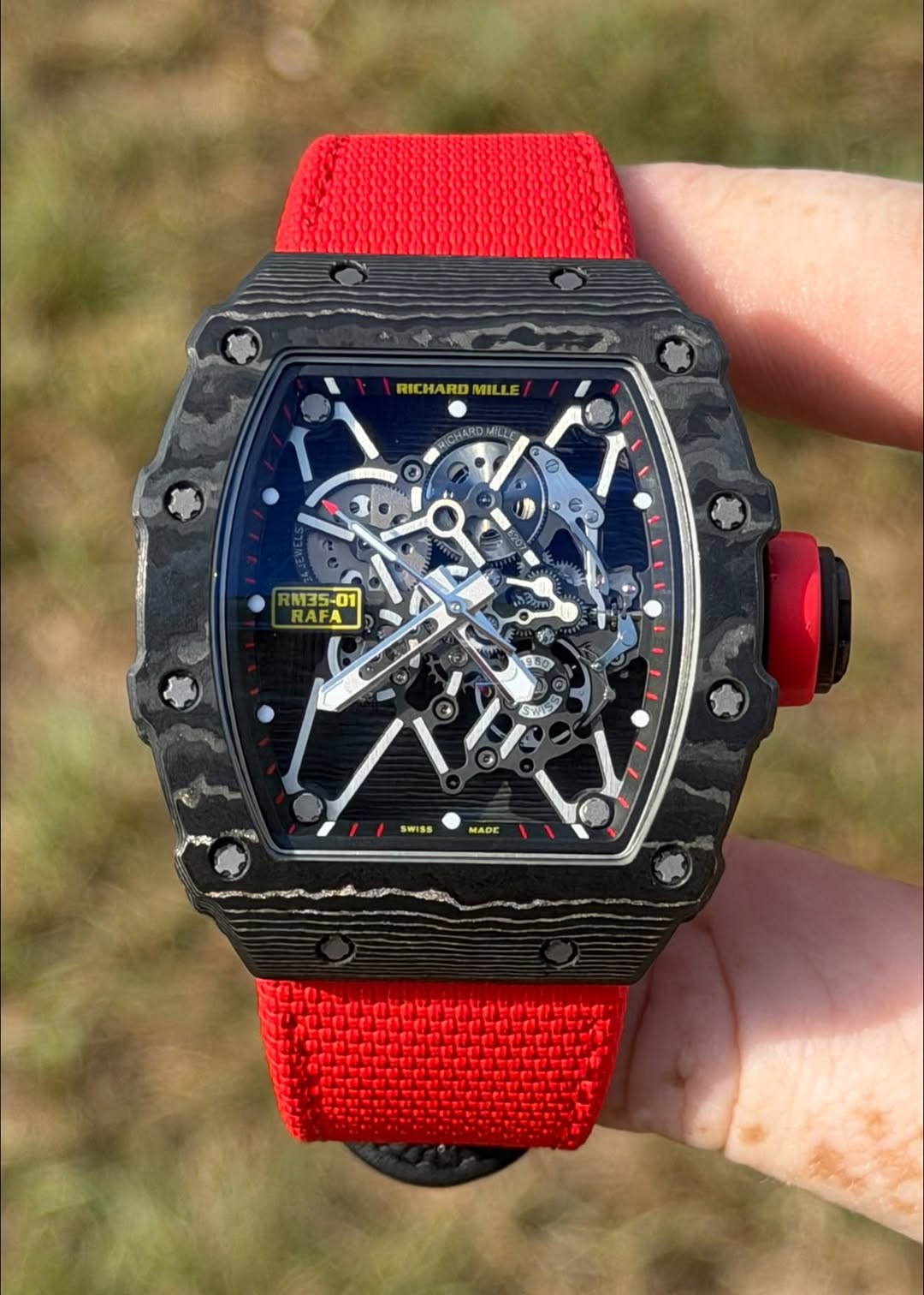 May be an image of digital watch and text that says 'RICHARDMILLE MILLE CHARD ARD MILLE MNDI RM35- 01 KES RAFA م 4p 50 SWIS SW ה SWISS MAФΕ'