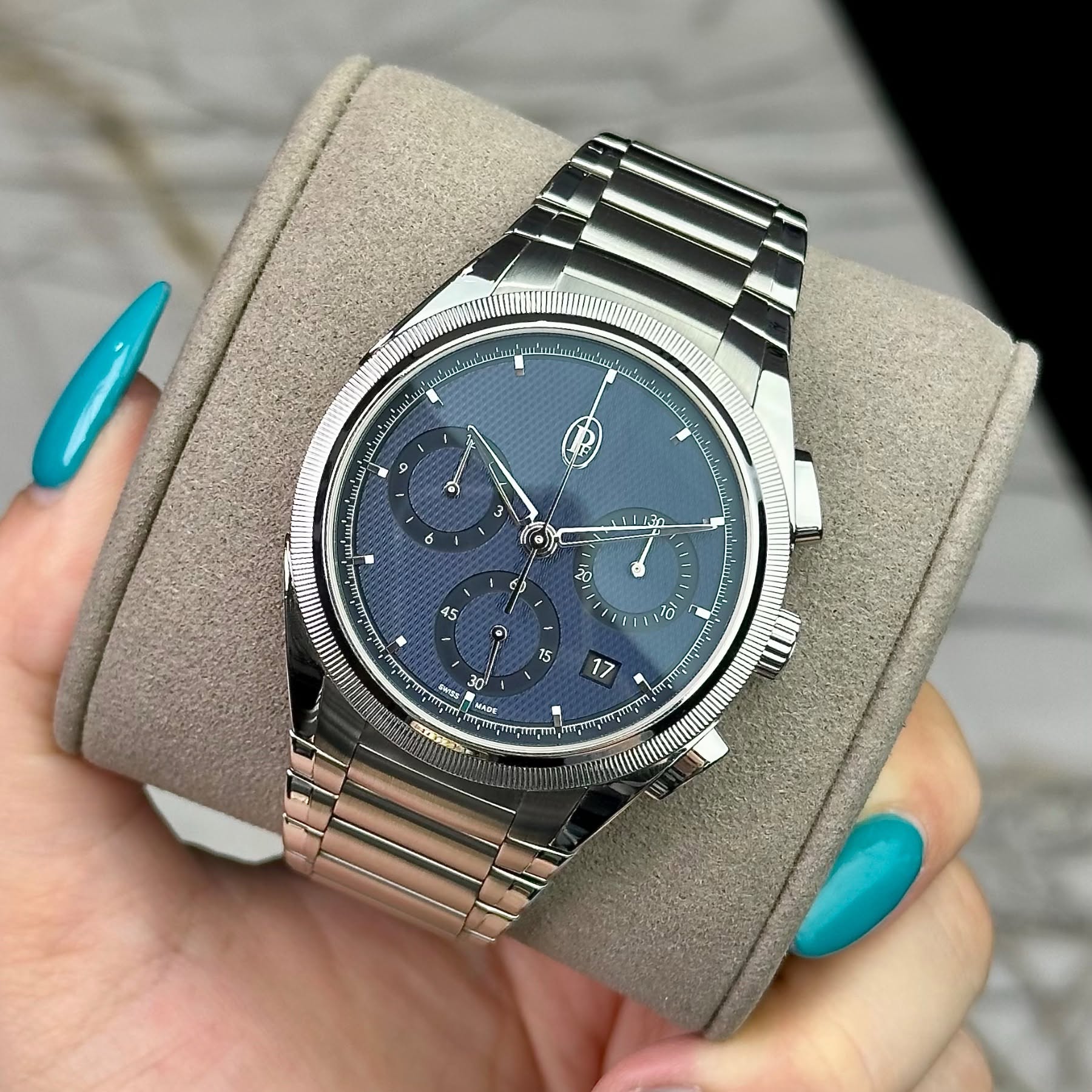 May be an image of wrist watch and text