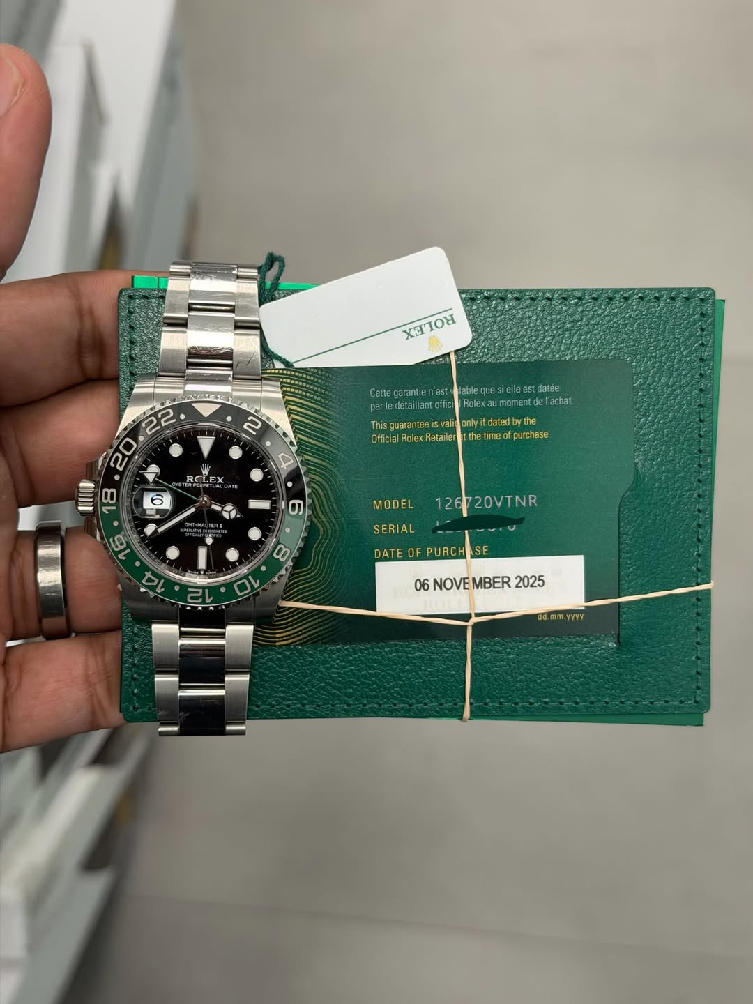 May be an image of wrist watch and text