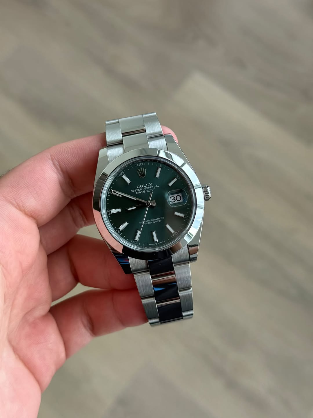 May be an image of wrist watch and text
