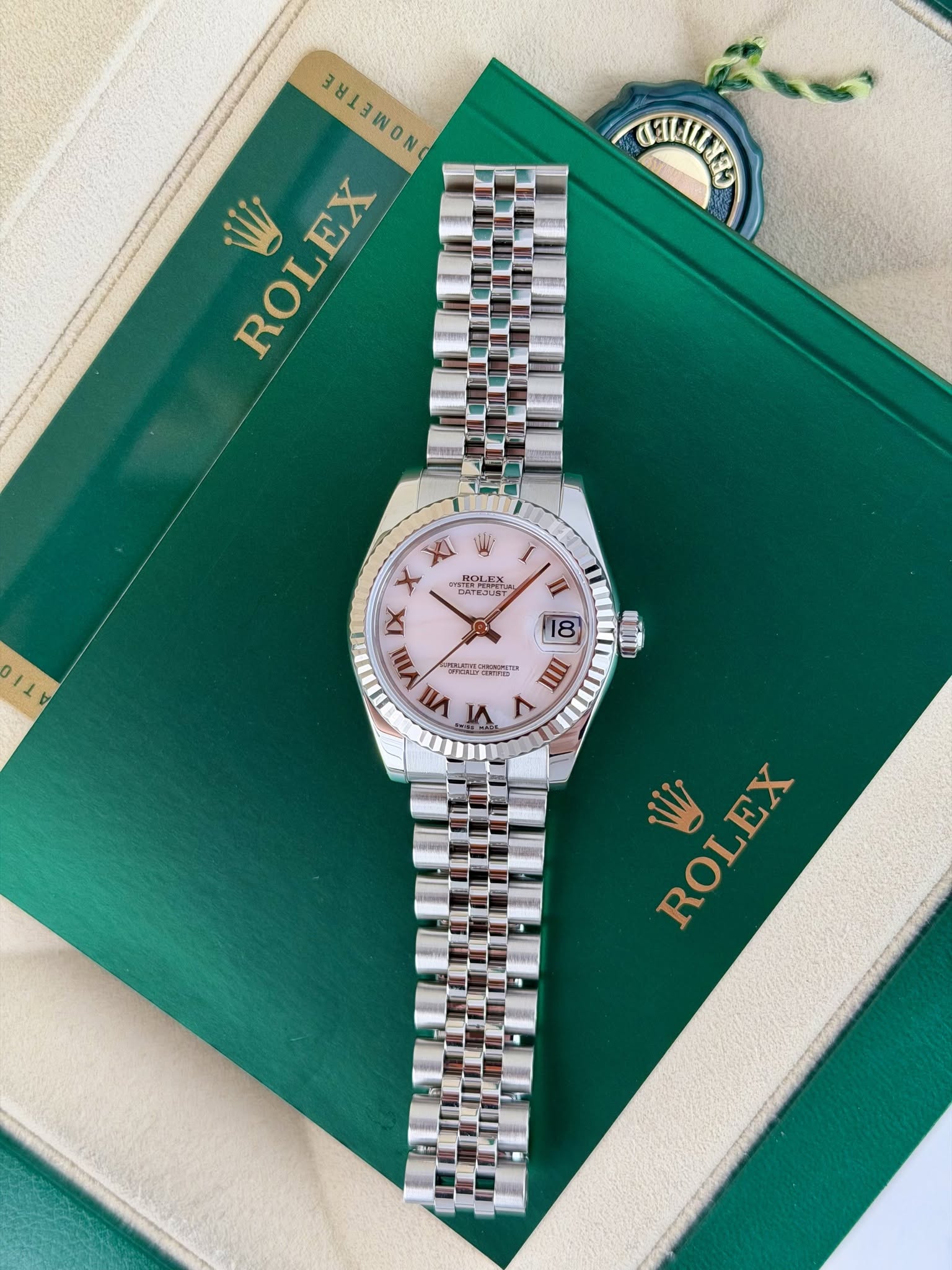 May be an image of wrist watch and text