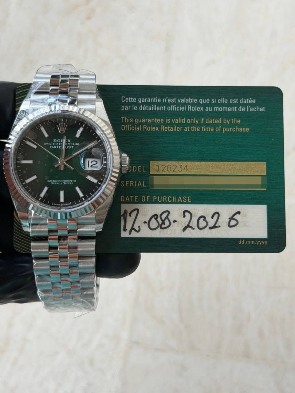May be an image of wrist watch and text