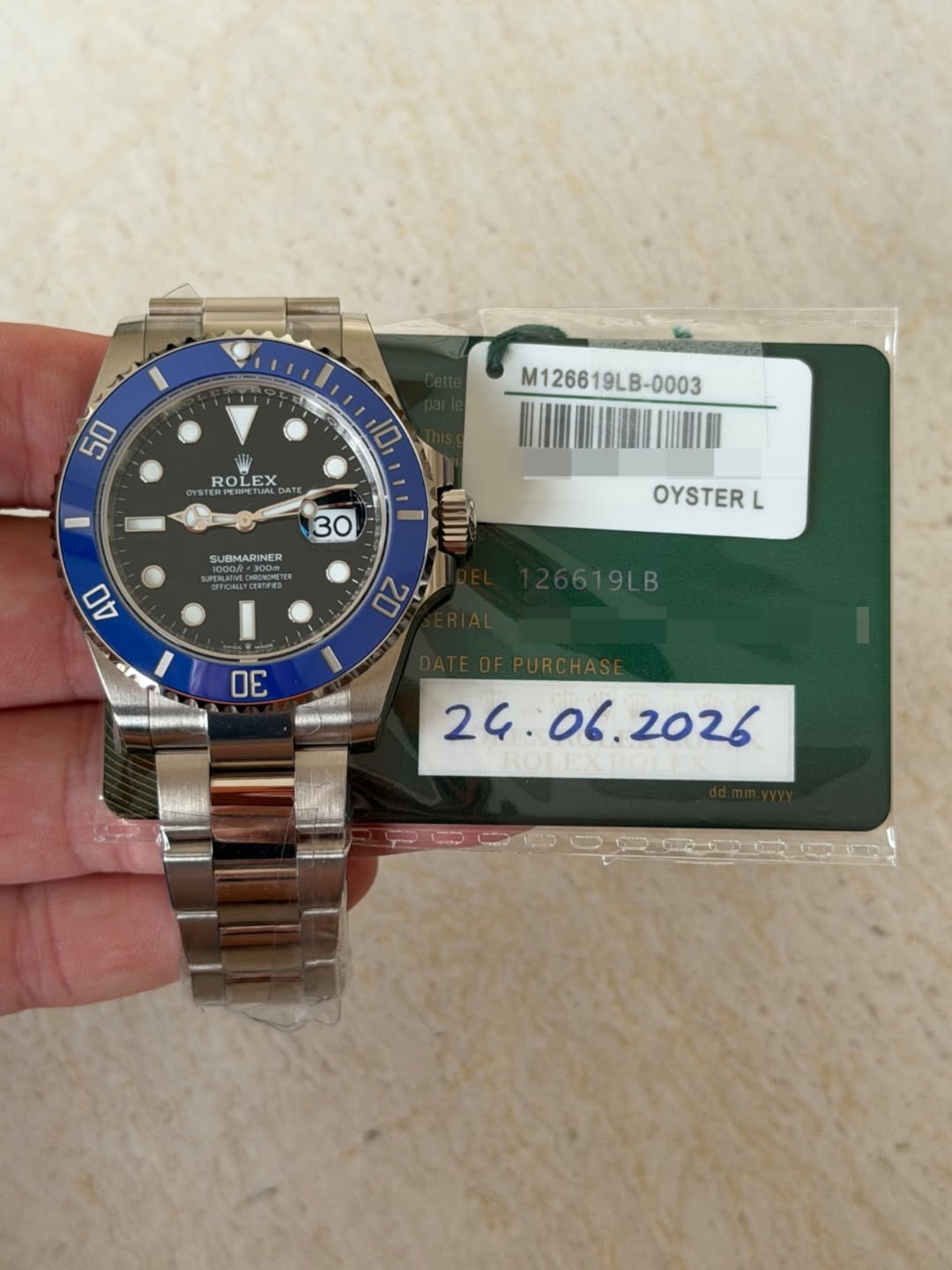 May be an image of wrist watch and text that says '50 M126619LB-0003 M12661 9LB-0003 10 ROLEX E REEGE ALD DA 30 GUBMARINER SPERLAFIVE EDHIONCHI 40 OYSTERL L 02 20 619LB E DE uMAu '
