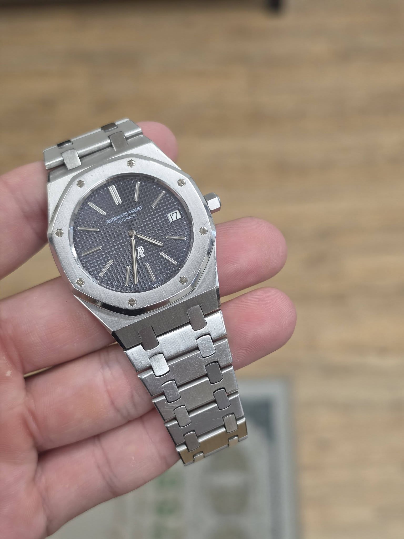 May be an image of wrist watch and text