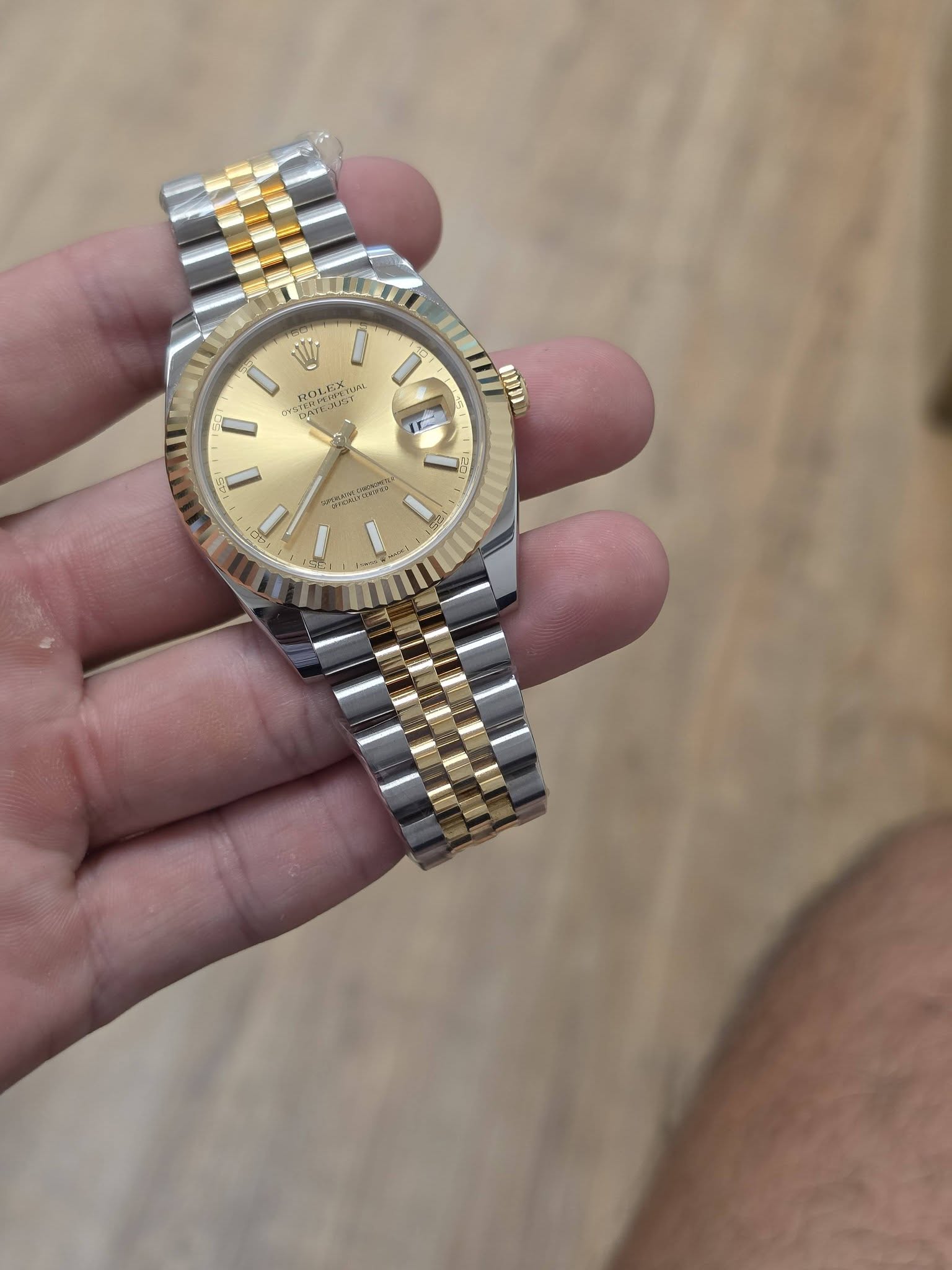 May be an image of wrist watch and text