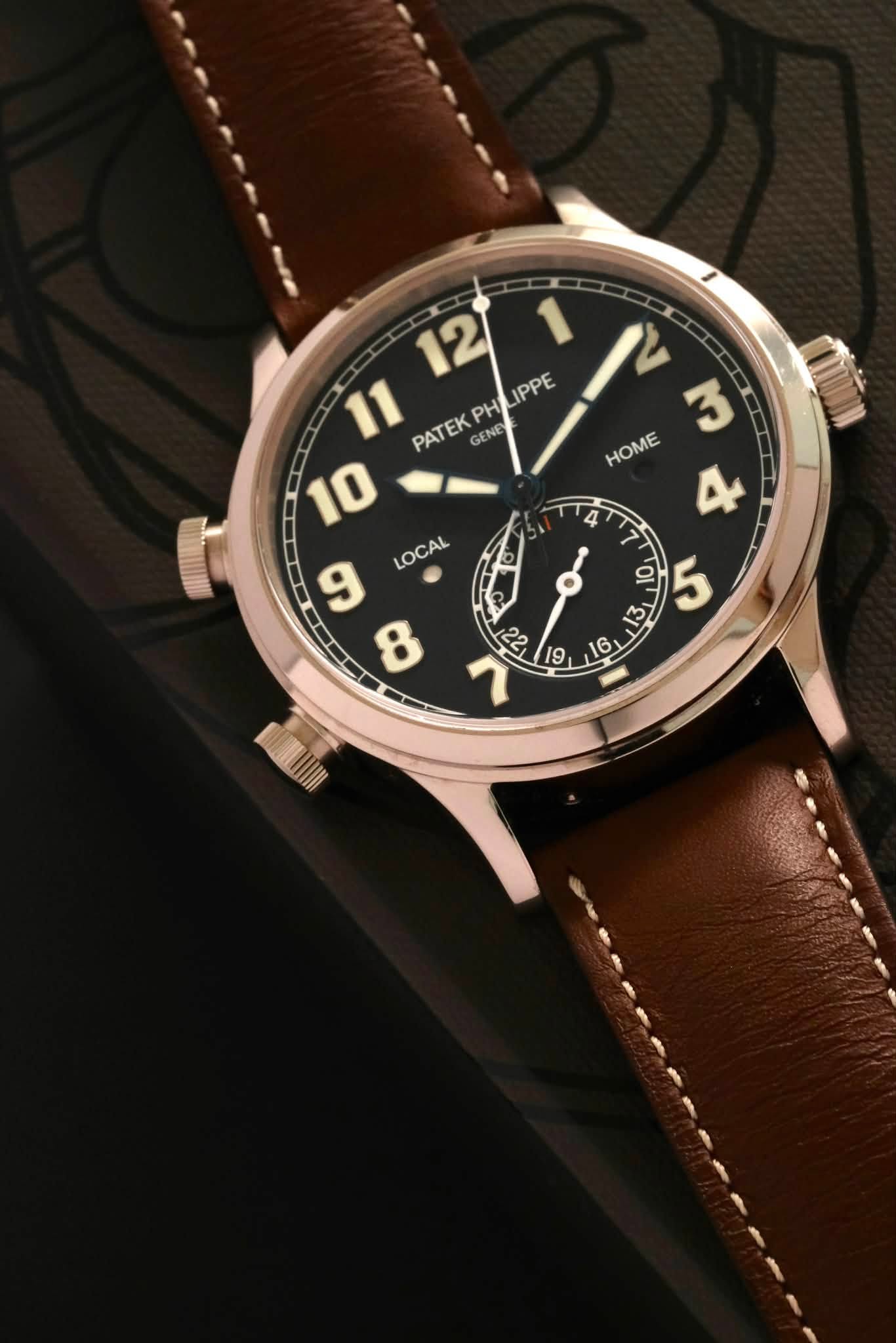 May be an image of wrist watch and text that says '12 IPPE 11 PATEK GENE PH 10 LOCAL MAO M 重 HOME D 13 13 이 '