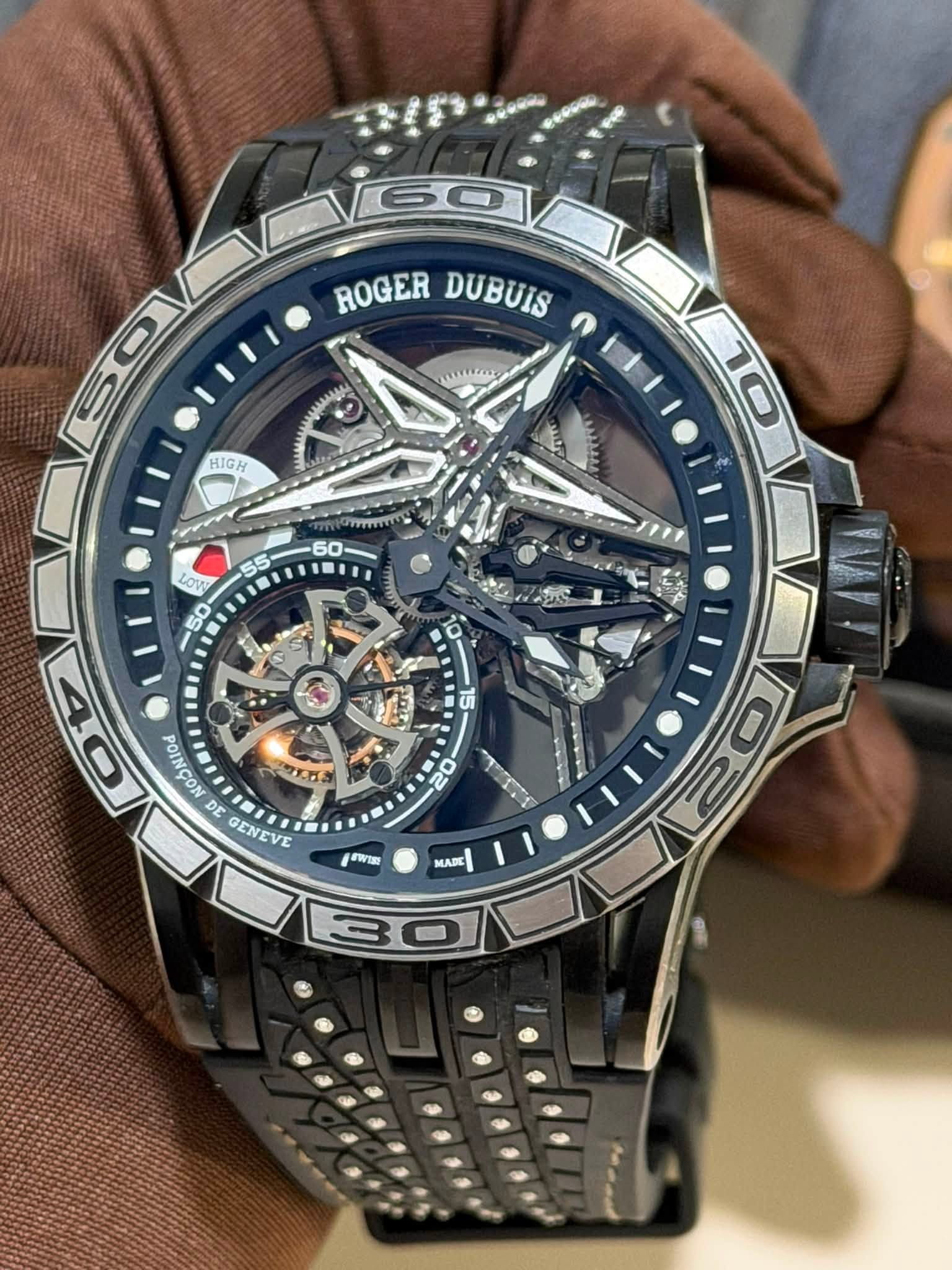 May be an image of wrist watch and text