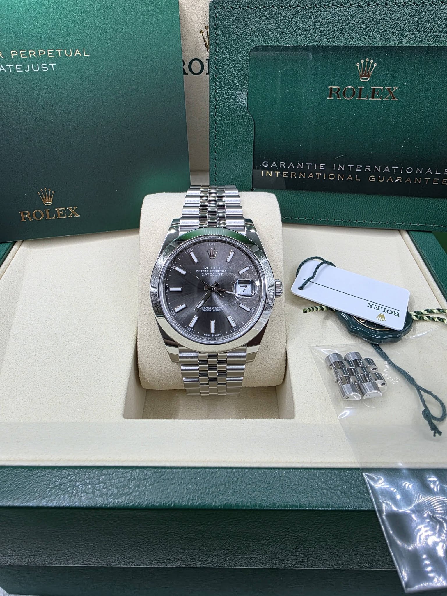 May be an image of wrist watch and text
