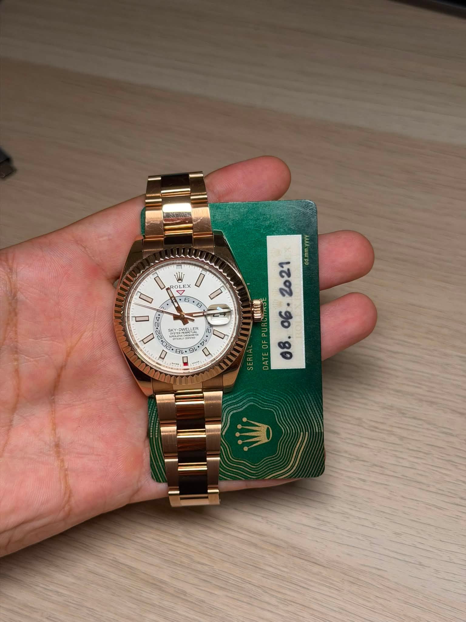 May be an image of wrist watch and text
