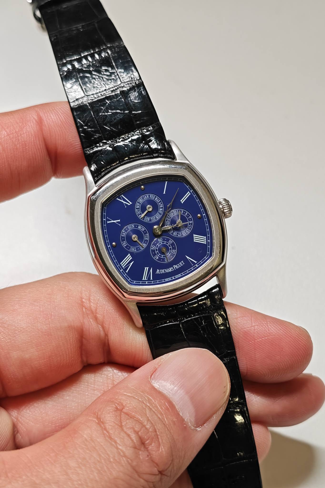 May be an image of wrist watch and text