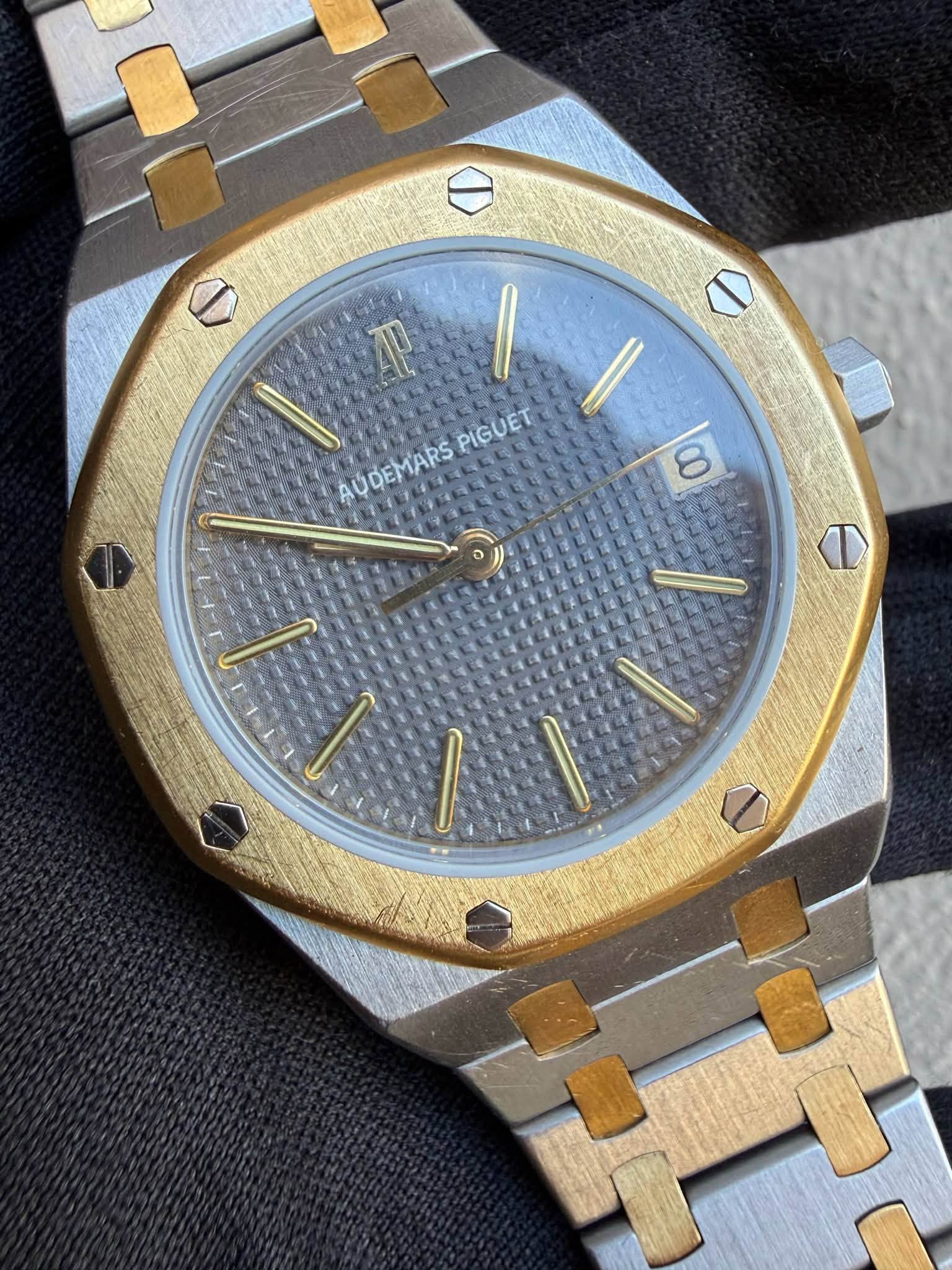 May be an image of wrist watch and text