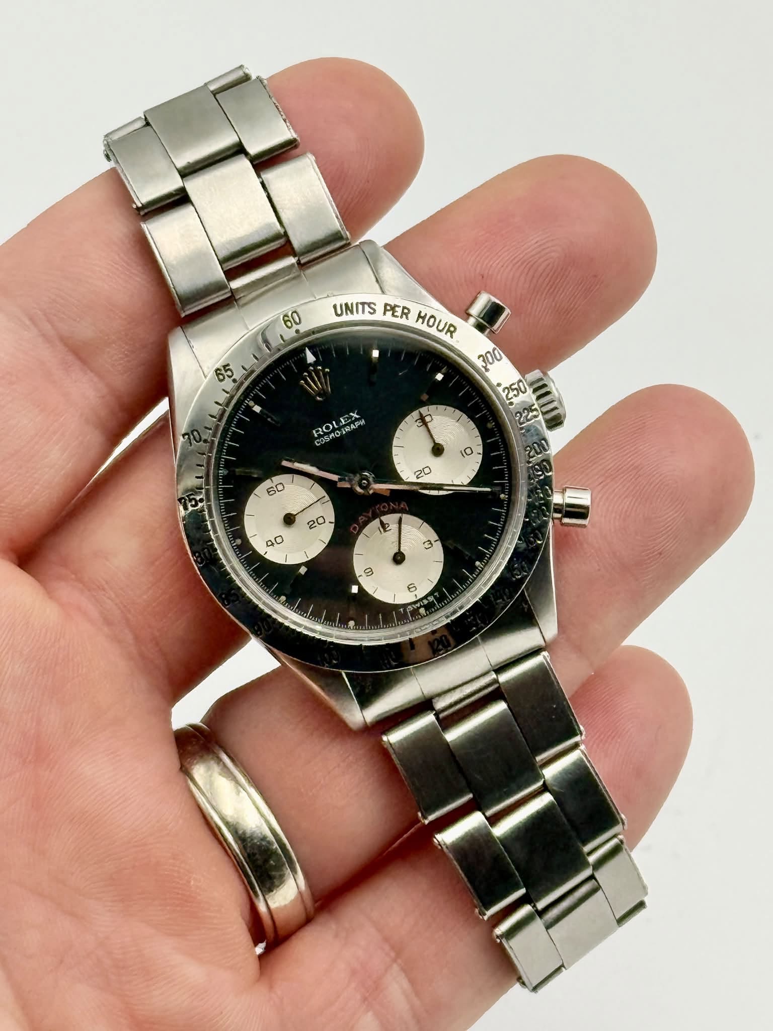 May be an image of wrist watch and text