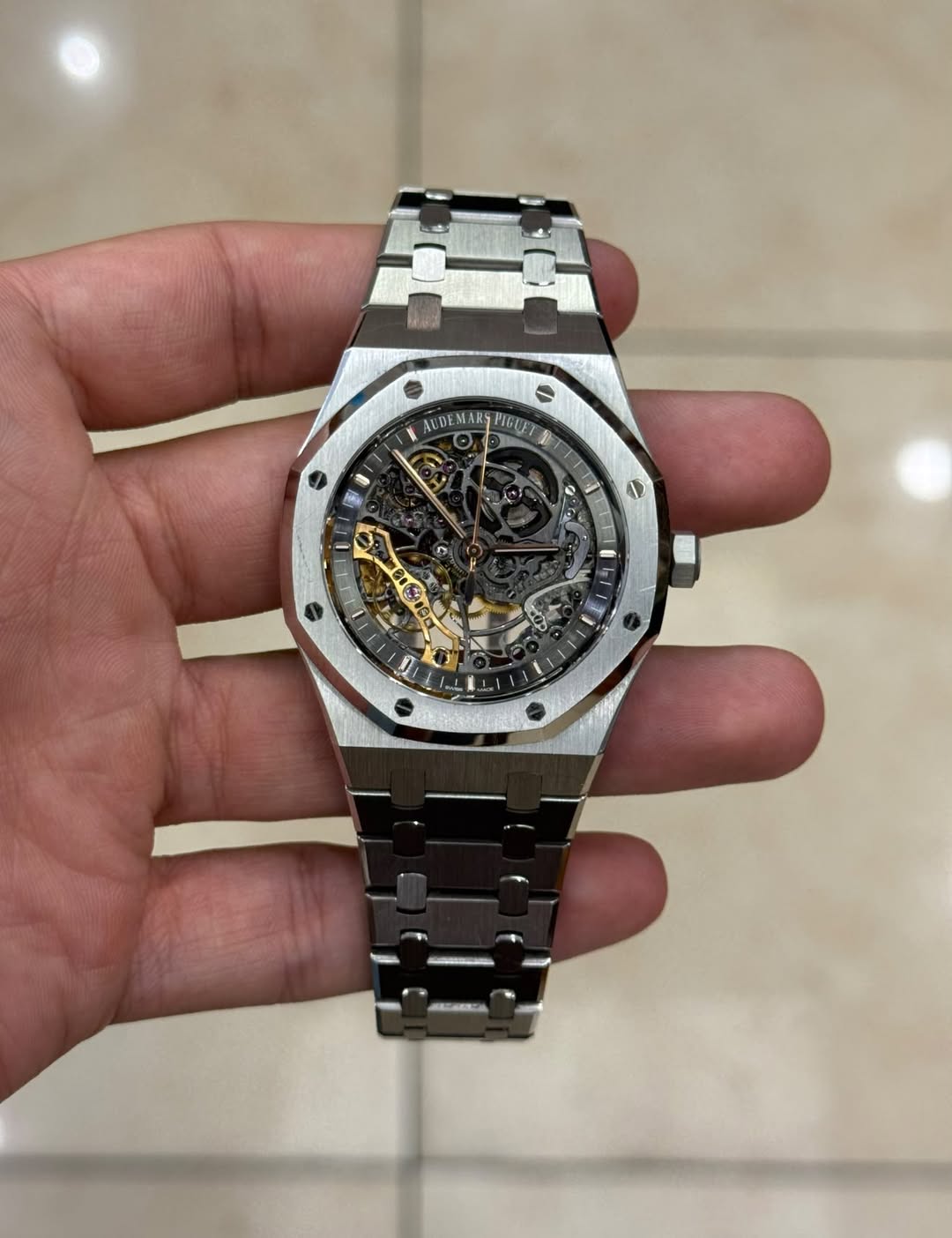 May be an image of wrist watch and text
