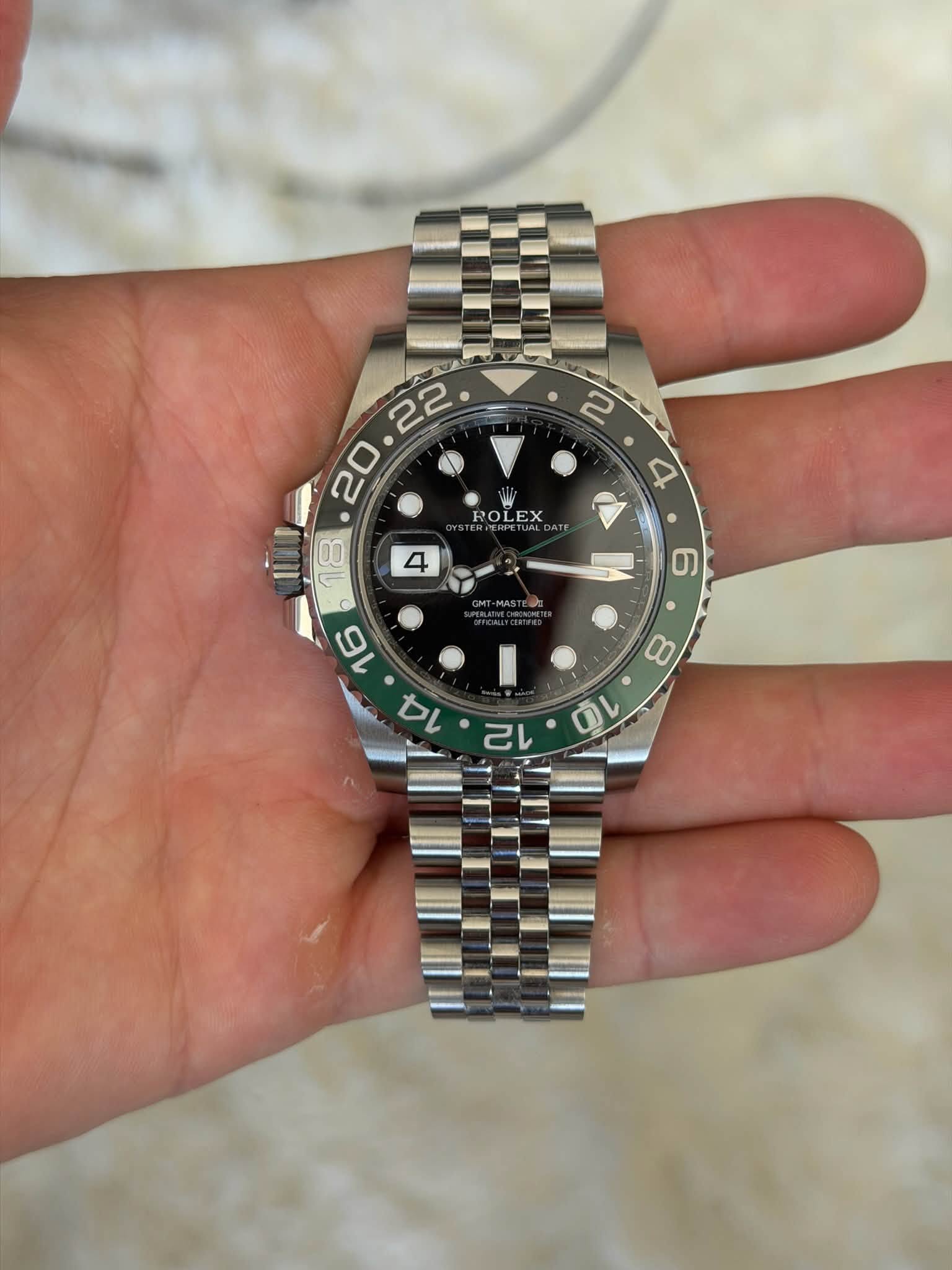 May be an image of wrist watch and text