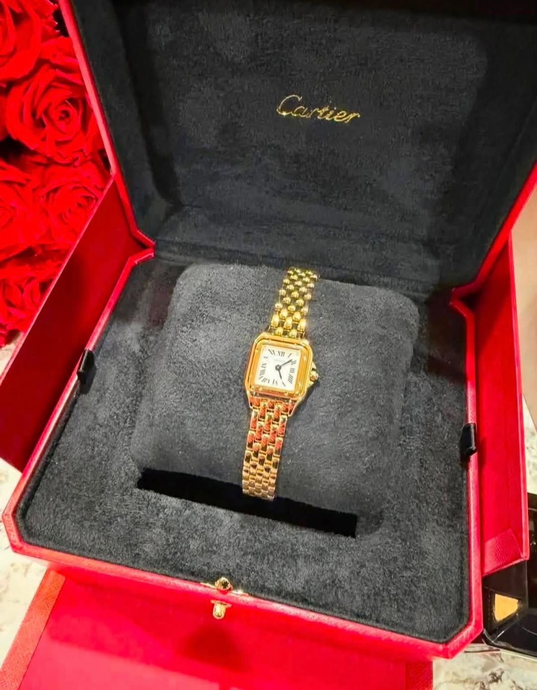 May be an image of wrist watch and text