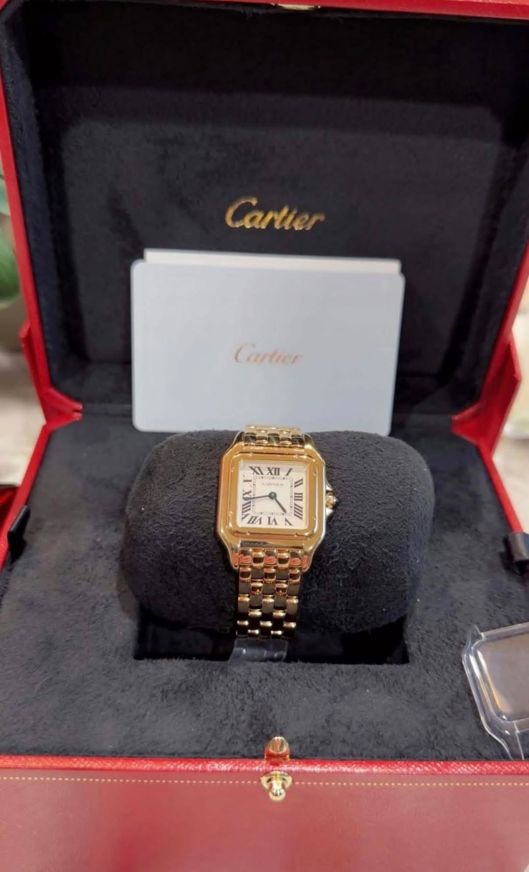 May be an image of wrist watch and text that says 'Cartier naлиe Cartier XI XlI ILA L IA 1'