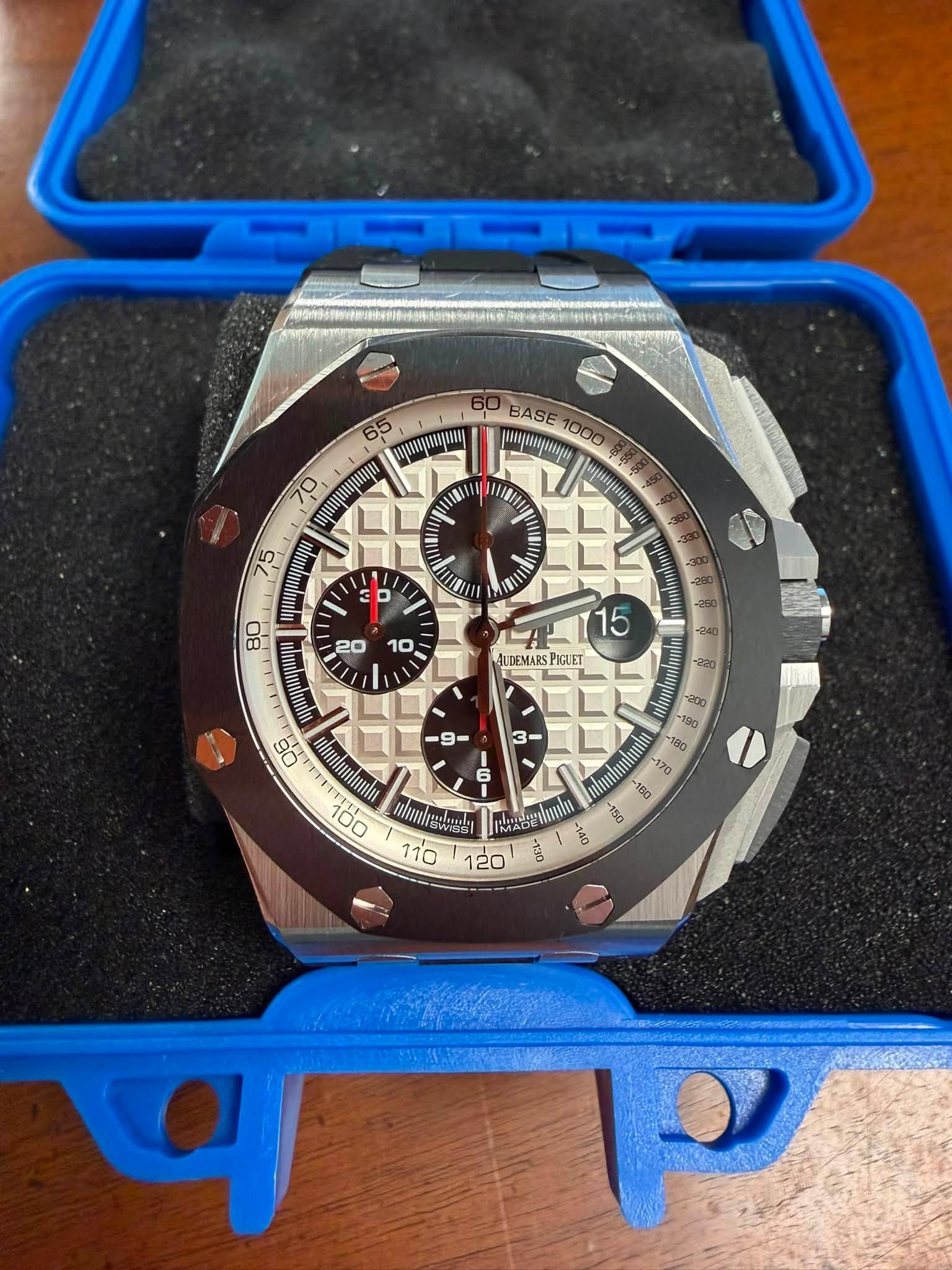 May be an image of wrist watch and text
