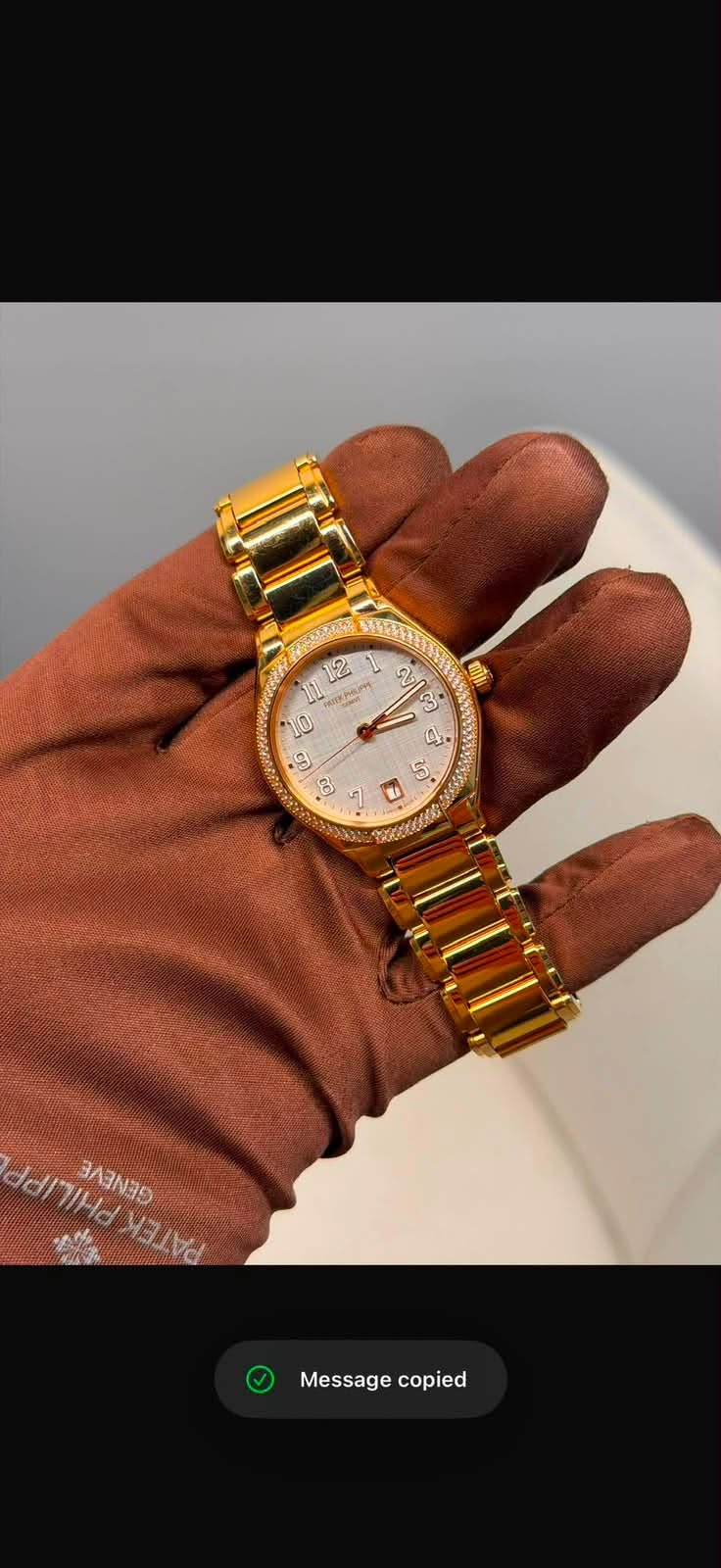 May be an image of jewelry, digital watch and text