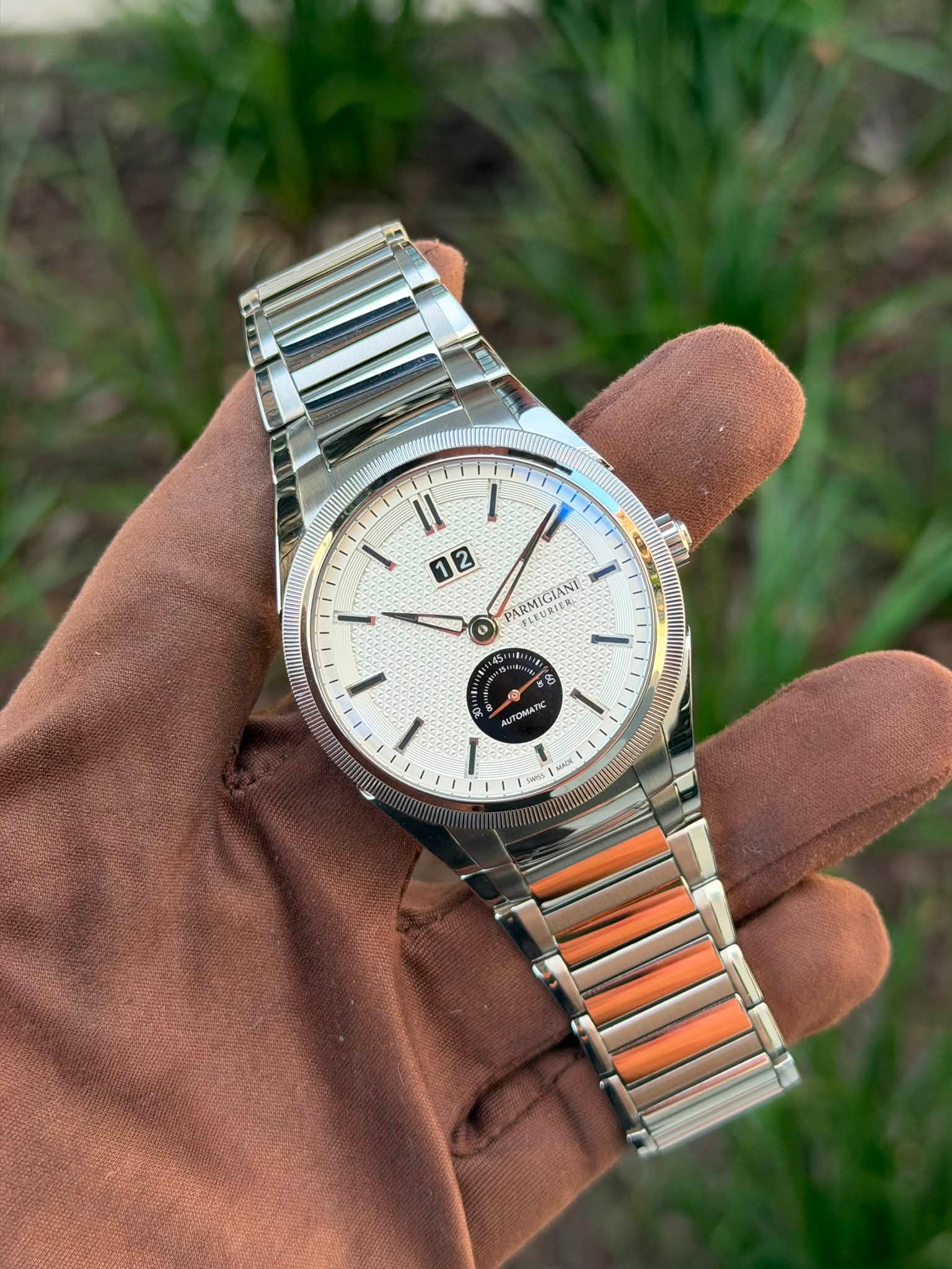 May be an image of wrist watch and text that says 'II I 12 2 ARMIGIANI ARRURIERS FLEURIE ® UTONA sansk POLL m Moc'