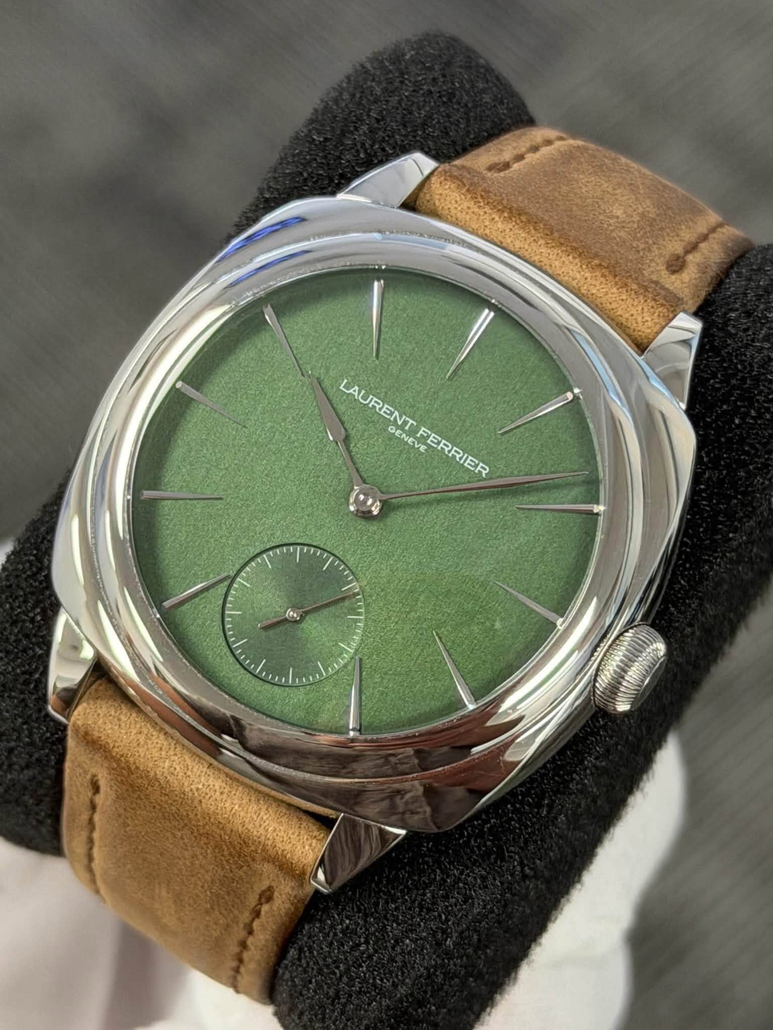 May be an image of wrist watch and text that says 'LAURENT GENEV LAURENTFERRI EVE FERRIER FERRIEF ما (, ምጣ نن 0'