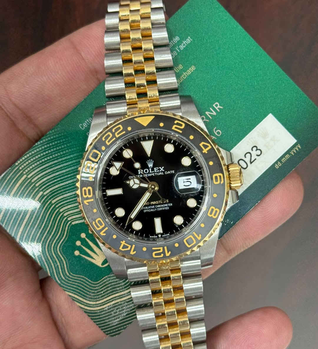 May be an image of wrist watch and text