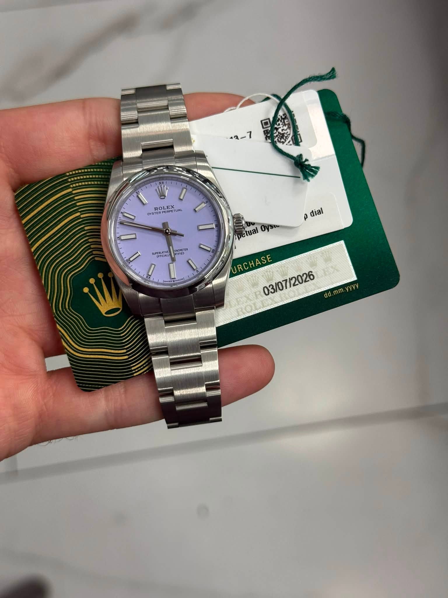 May be an image of wrist watch and text