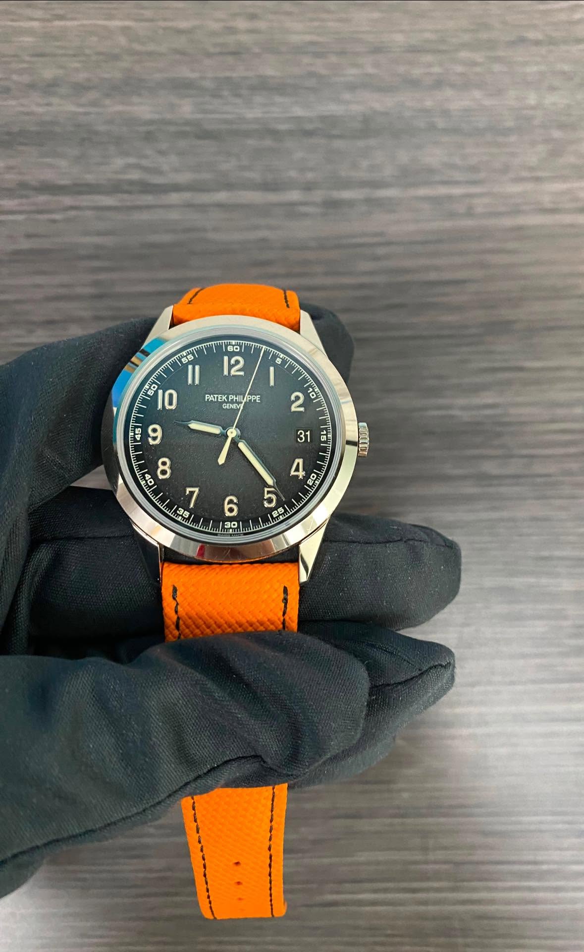 May be an image of wrist watch and text