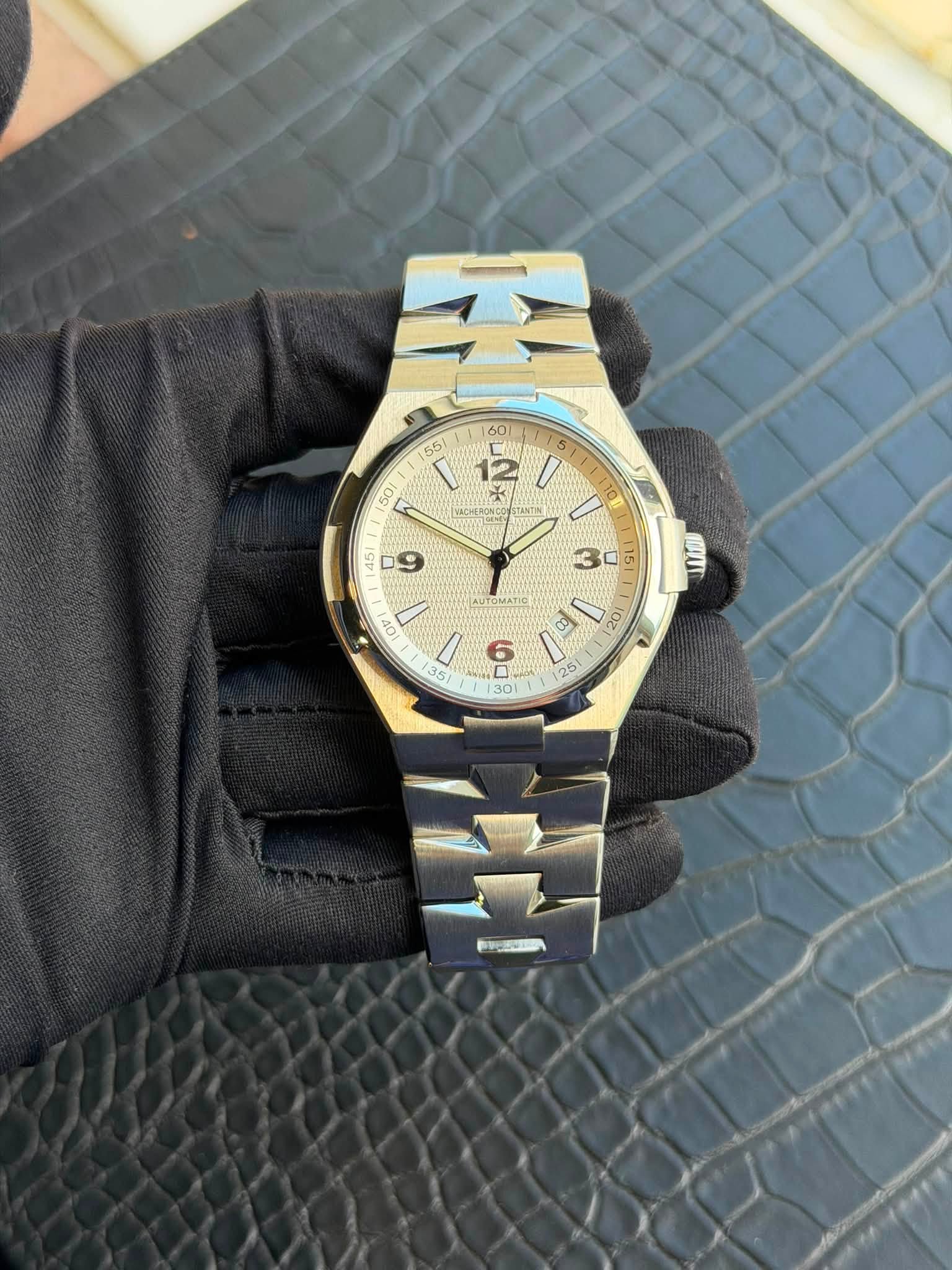 May be an image of wrist watch and text