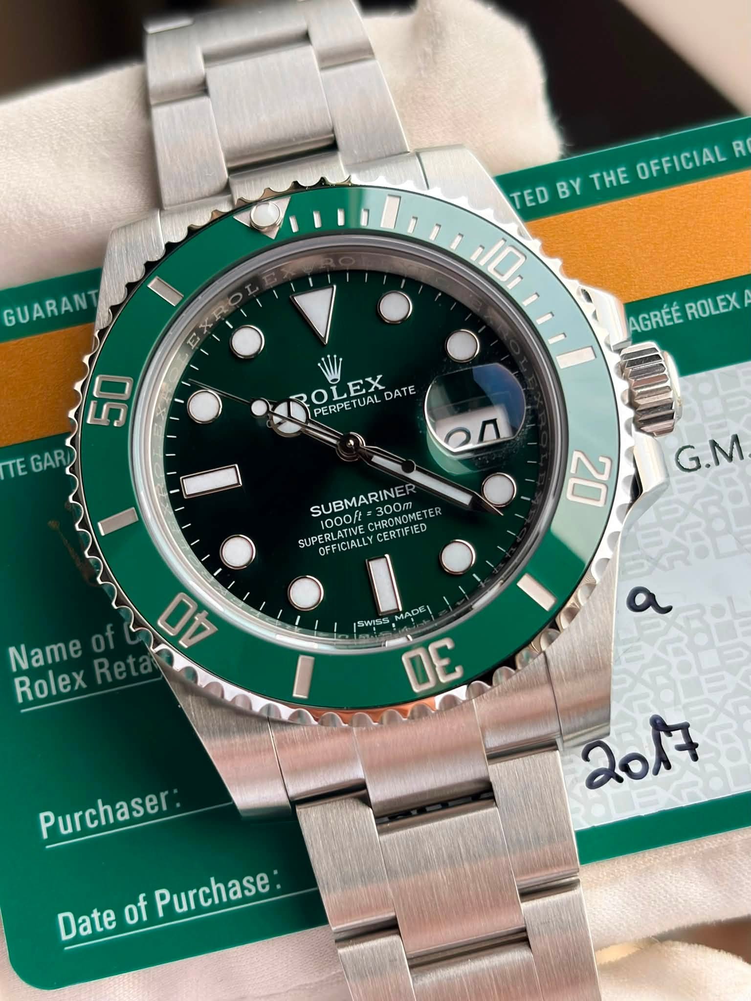 May be an image of wrist watch and text that says 'TED BY THE OFFICIAL R 10 GUARAN E XR AGRÉÉ AGRÉÉROLEX ROLEX ROLEX LEX PETUAL DATE PERPETUAL PERPE 50 TEGAR TE GAR SUBMARINE /2…