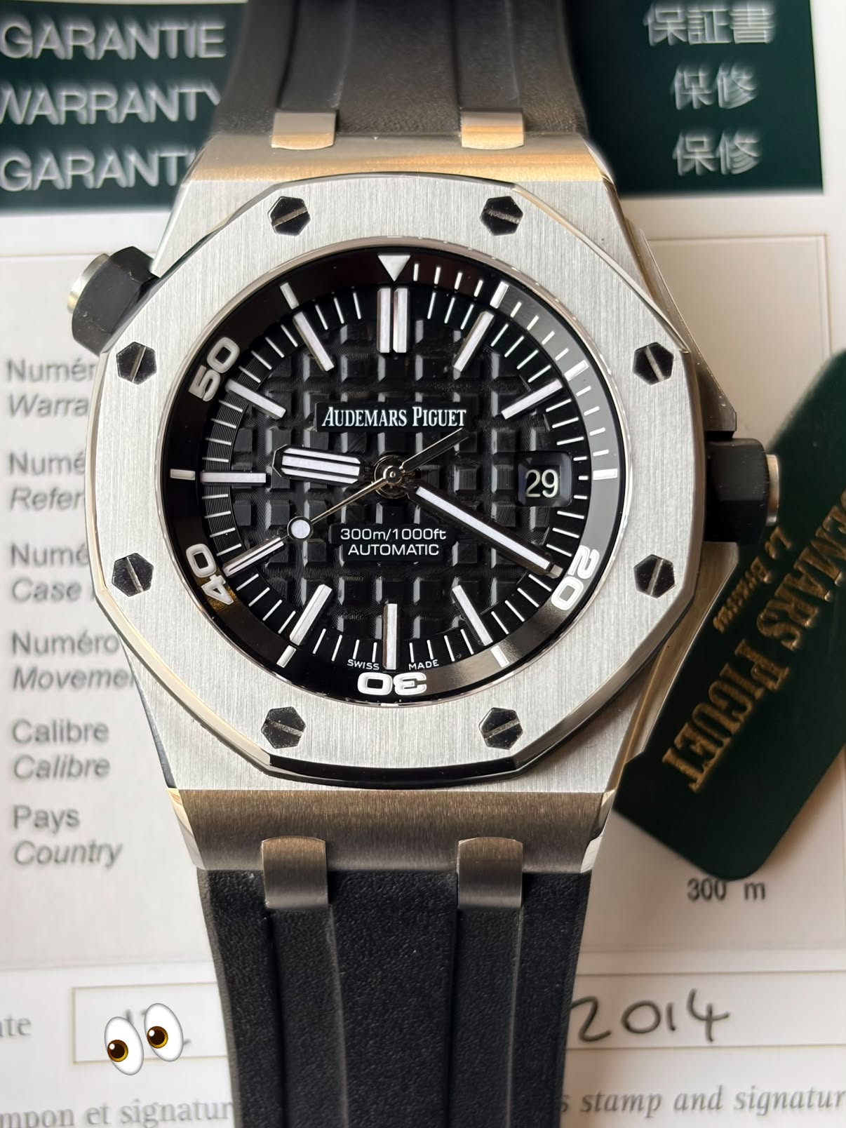 May be an image of wrist watch and text that says 'GARANTIE WARRANT™ GARANT 保証書 傑修 保修 Numér Warra 50 Numé Refer AUDEMARS PIGUET Nume Case 29 300m/1000ft 300m/ 1000ft AUTOMATIC…