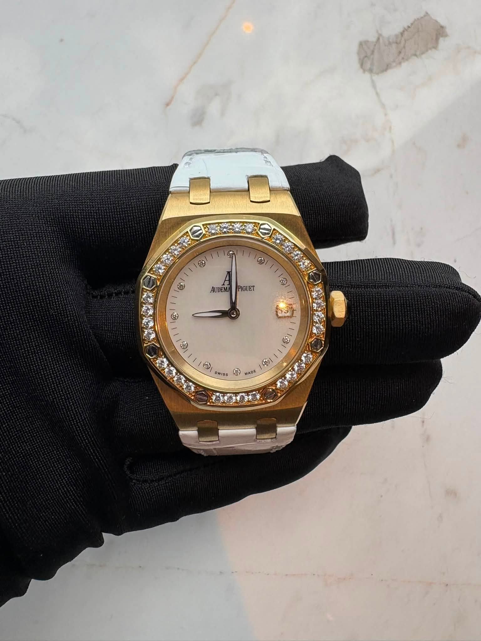 May be an image of wrist watch and text
