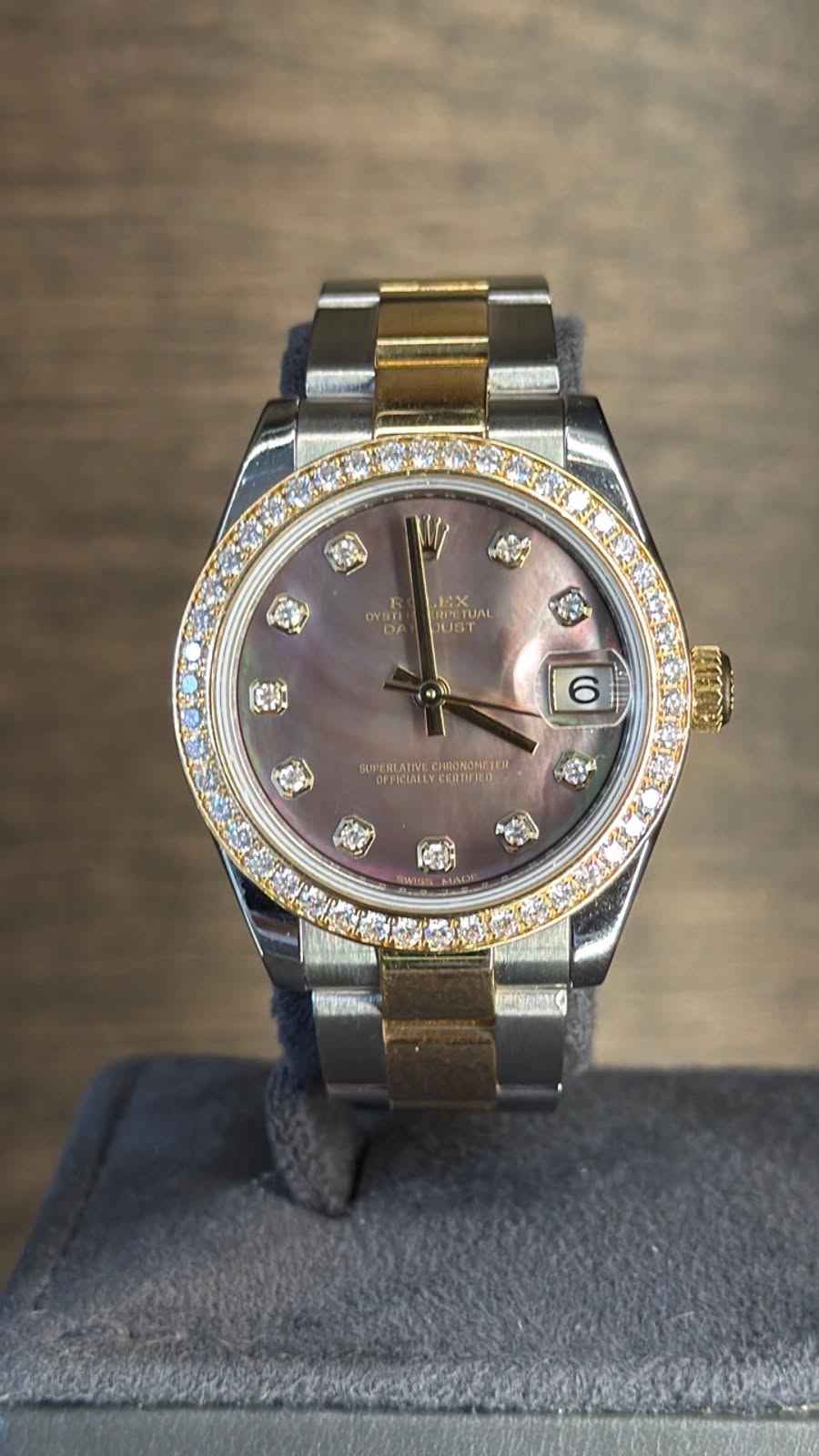 May be an image of wrist watch and text