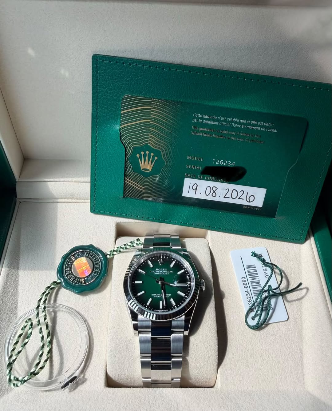 May be an image of wrist watch and text