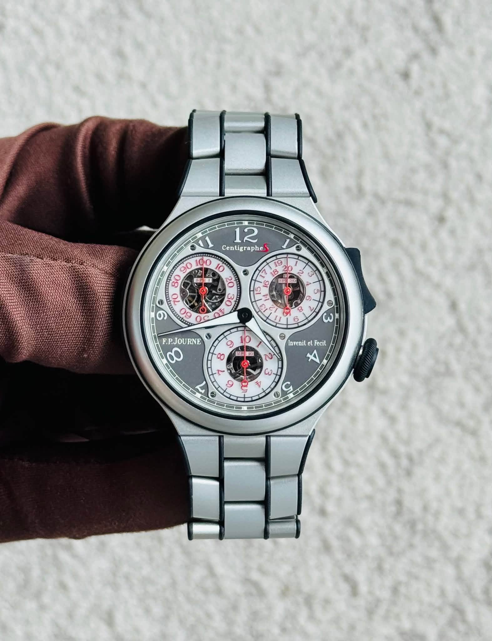 May be an image of wrist watch and text that says '12 Centigraphes phe O 0 9 00 វ ン O C 2 3 3 න. O i B B ی 6 F.PJOURNE 00 9 A दপ E M 0 O larenil Fecit လူမ X K. أ- 9 キ V CO u'