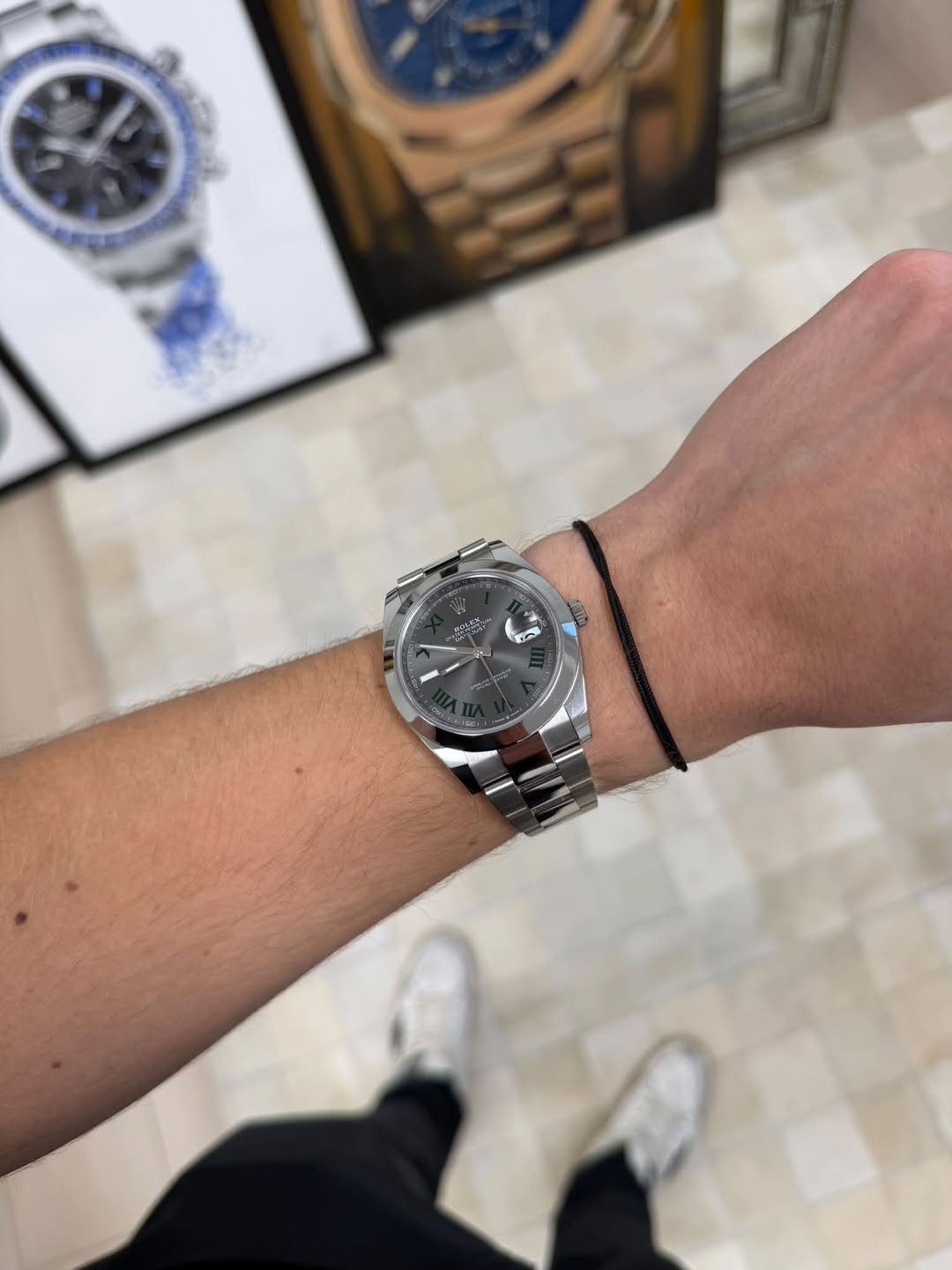 May be an image of wrist watch and text