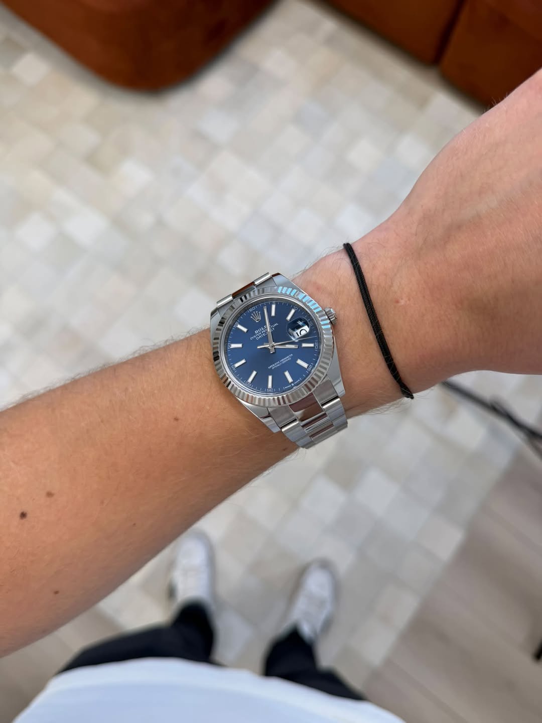May be an image of wrist watch and text