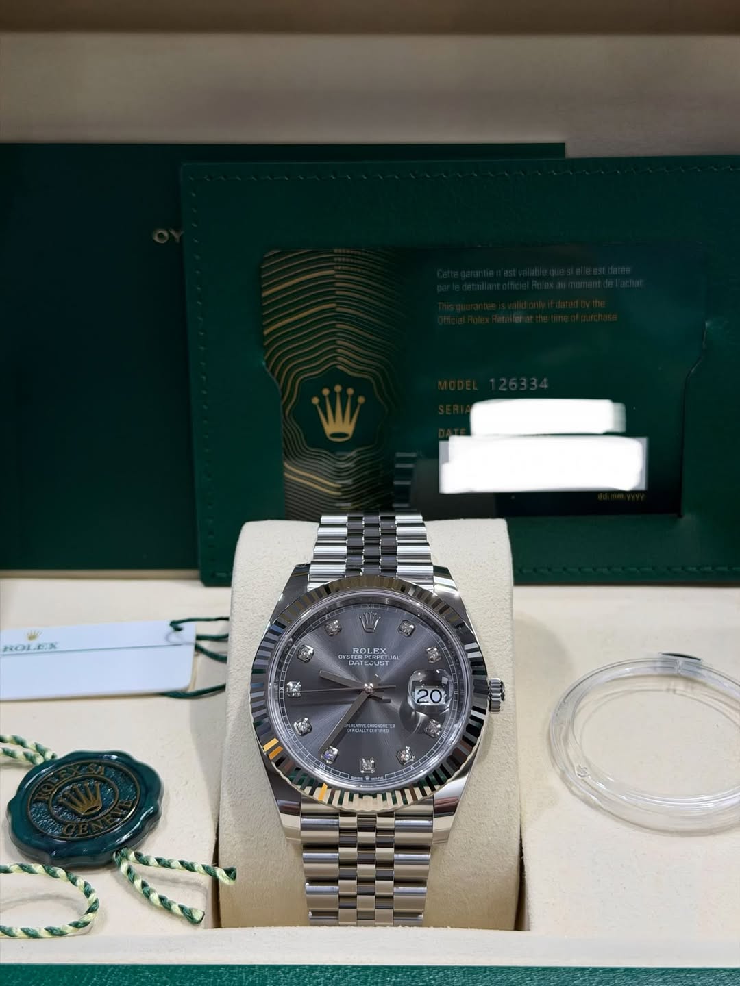 May be an image of wrist watch and text
