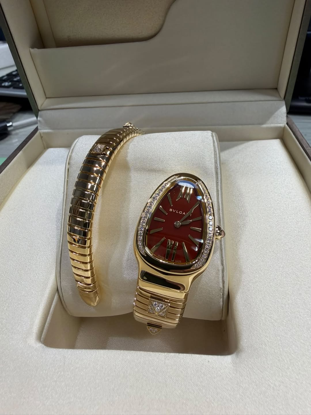 May be an image of jewelry, wrist watch and text