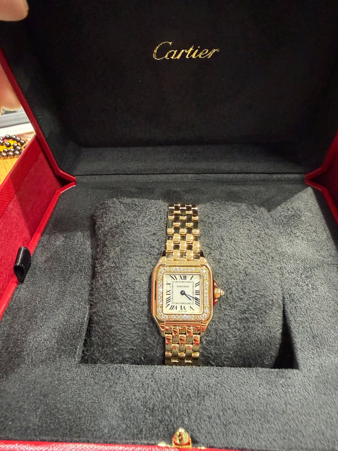 May be an image of wrist watch and text