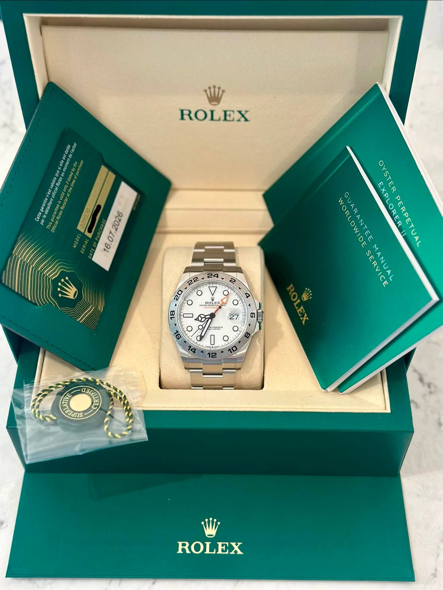May be an image of wrist watch and text that says 'ROLEX WORLDWIDE GUARANTEE GUAS EXPLORED EXPLOREETUAL タア OYSTER EXPLOREF PERPETUAL LDWIDE ANTEE SERVICE GUARANTEEMANU CANUAL…