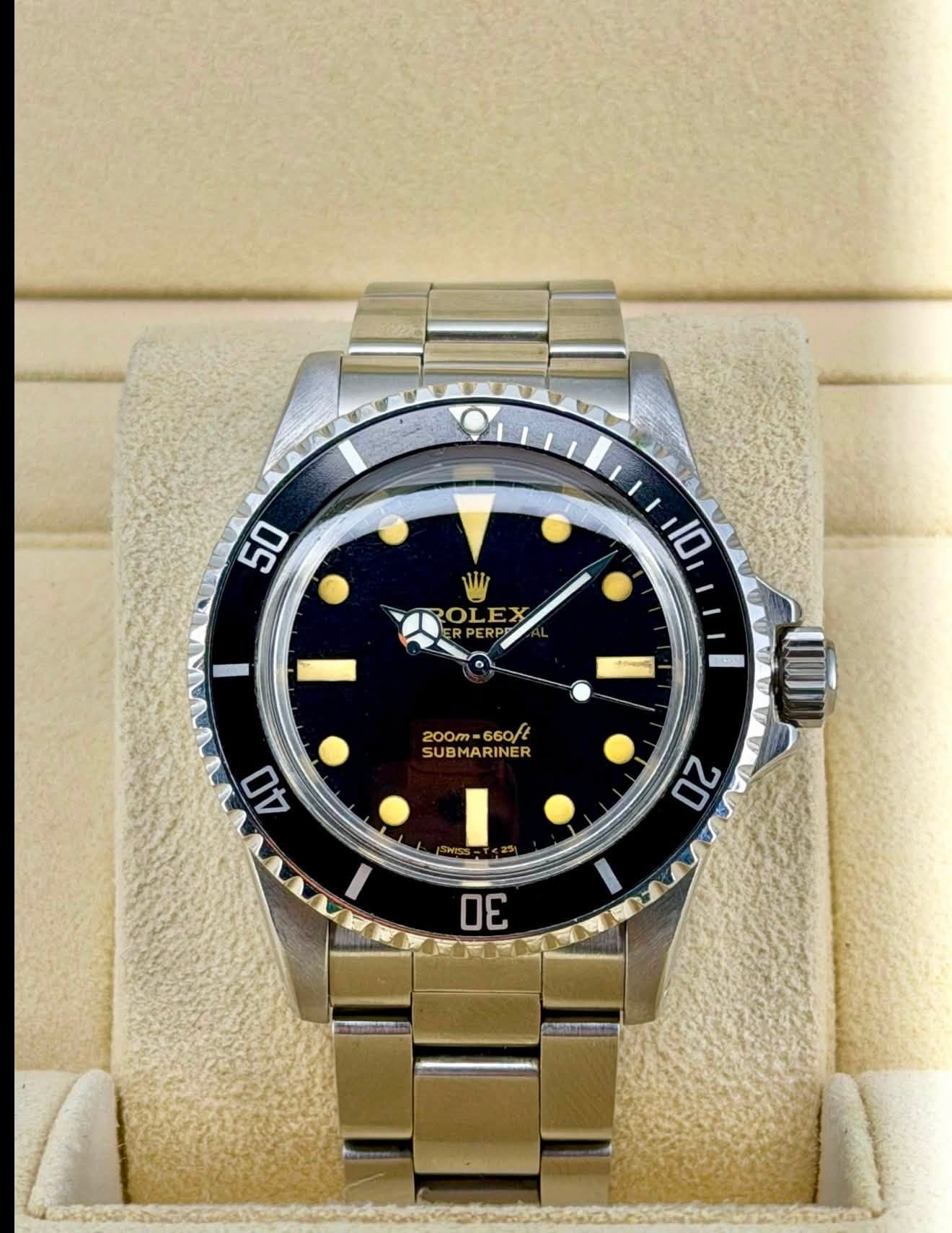 May be an image of wrist watch and text that says '50 10 ROLEX ROL PERP PER 200m-660/t 200m 660/t SUBMARINER ER 40 20 30'