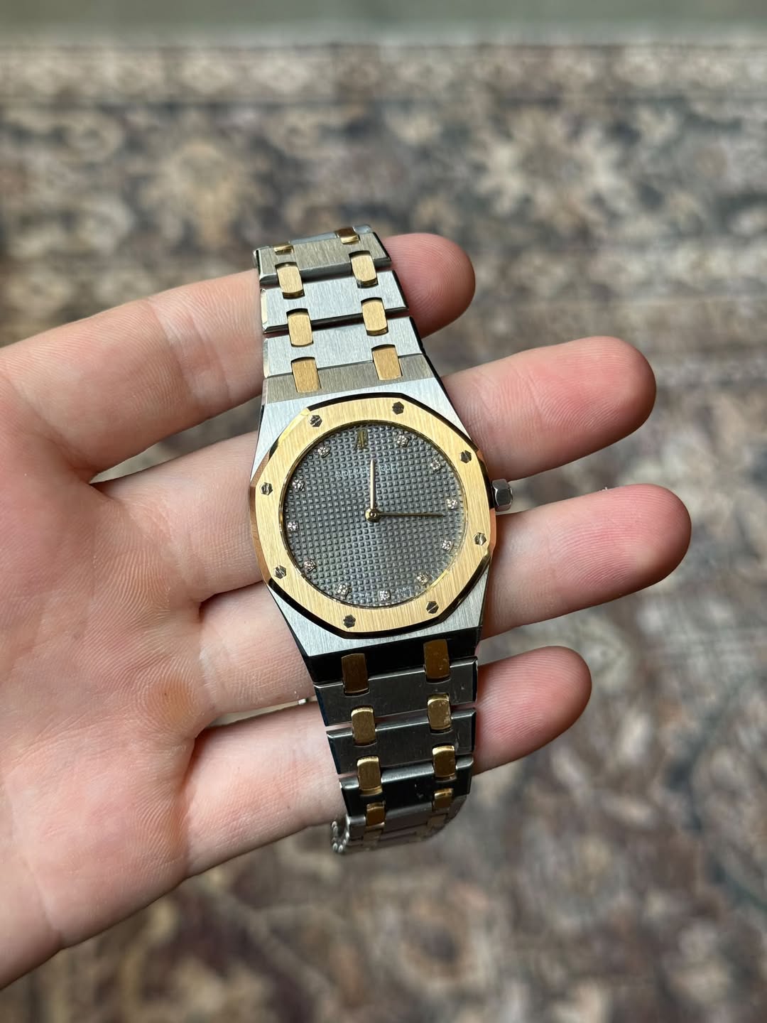 May be an image of wrist watch and text