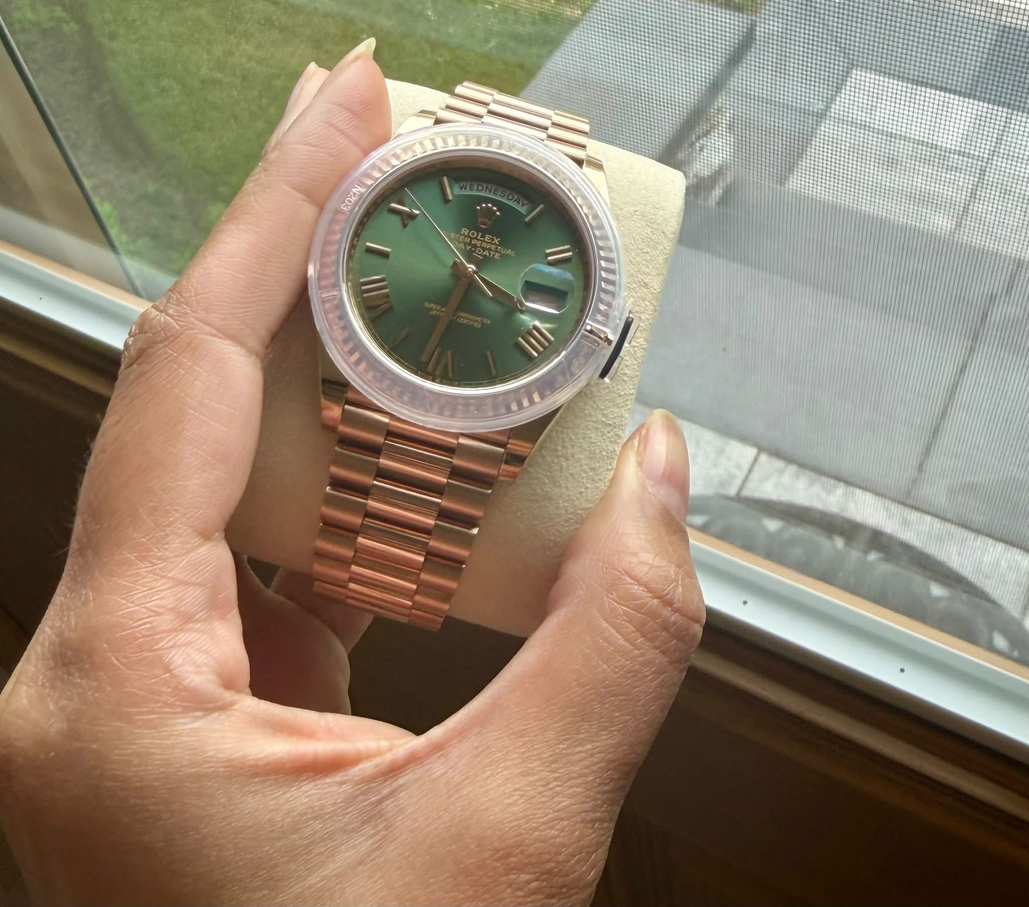 May be an image of wrist watch and text