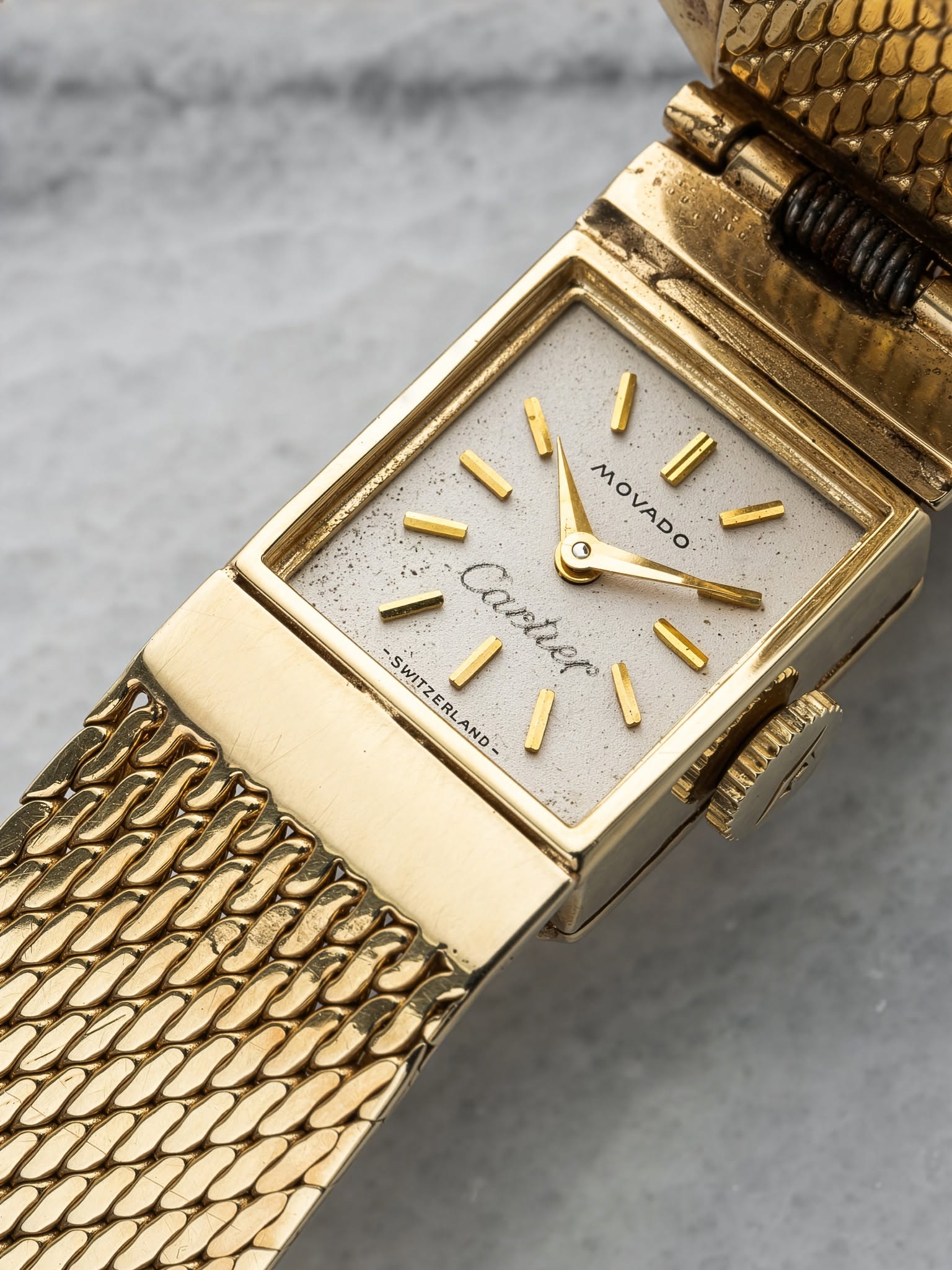 May be an image of wrist watch and text