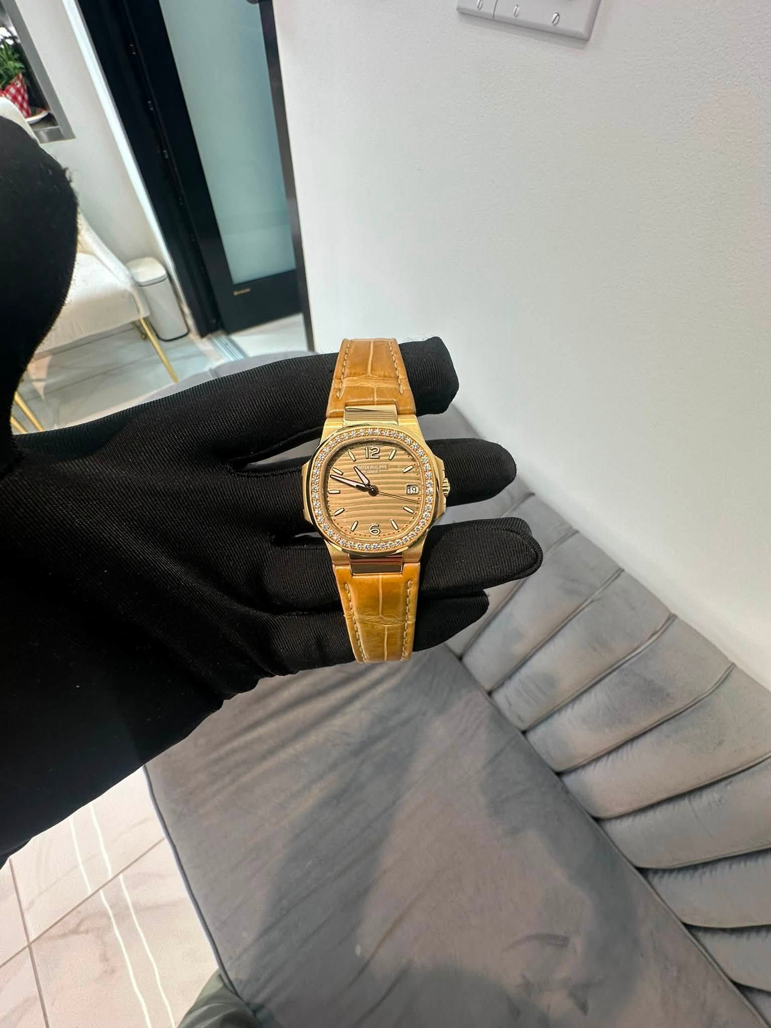 May be an image of wrist watch and text